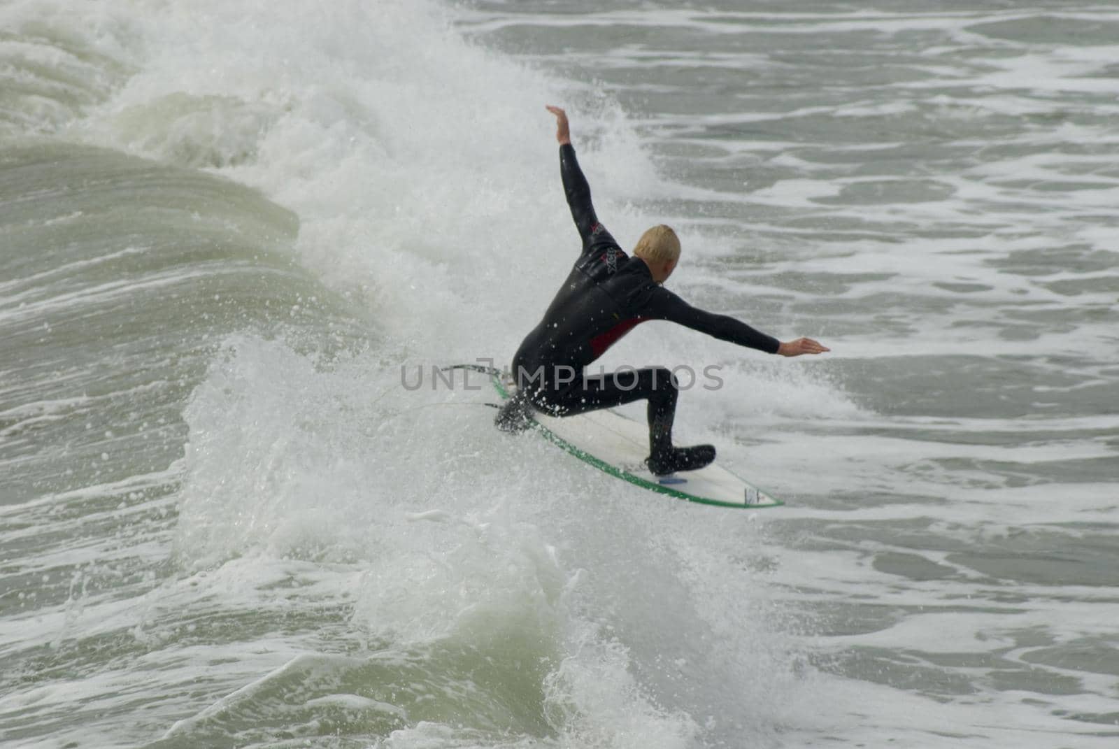 a surfers in the cold pacific waters off the californian coast