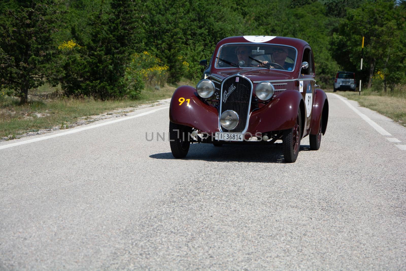 URBINO - ITALY - JUN 16 - 2022 : FIAT 508 S MM BALILLA BERLINETTA AERODINAMICA 1935 on an old racing car in rally Mille Miglia 2022 the famous italian historical race (1927-1957