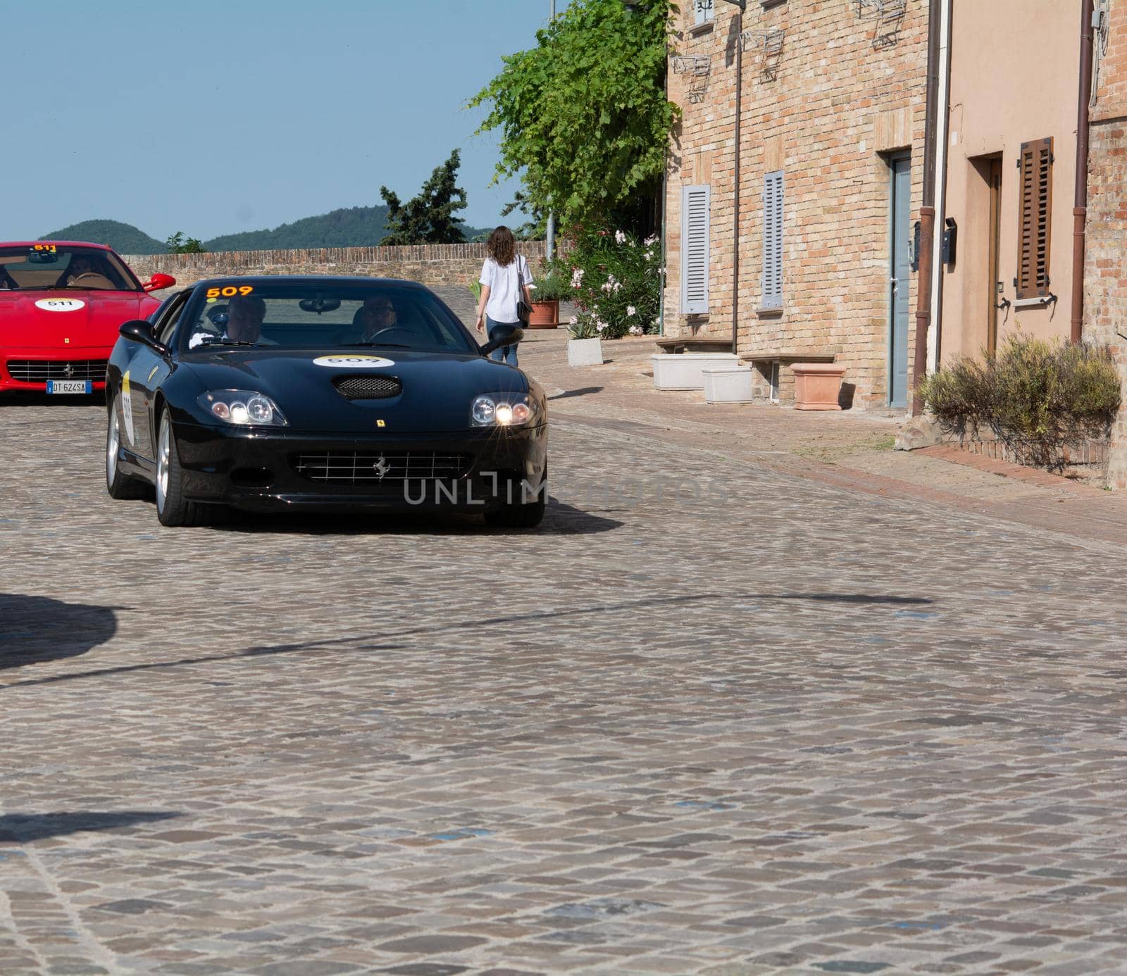 URBINO - ITALY - JUN 16 - 2022 : FERRARI SUPERAMERICA 2005 on an old racing car in rally Mille Miglia 2022 the famous italian historical race (1927-1957