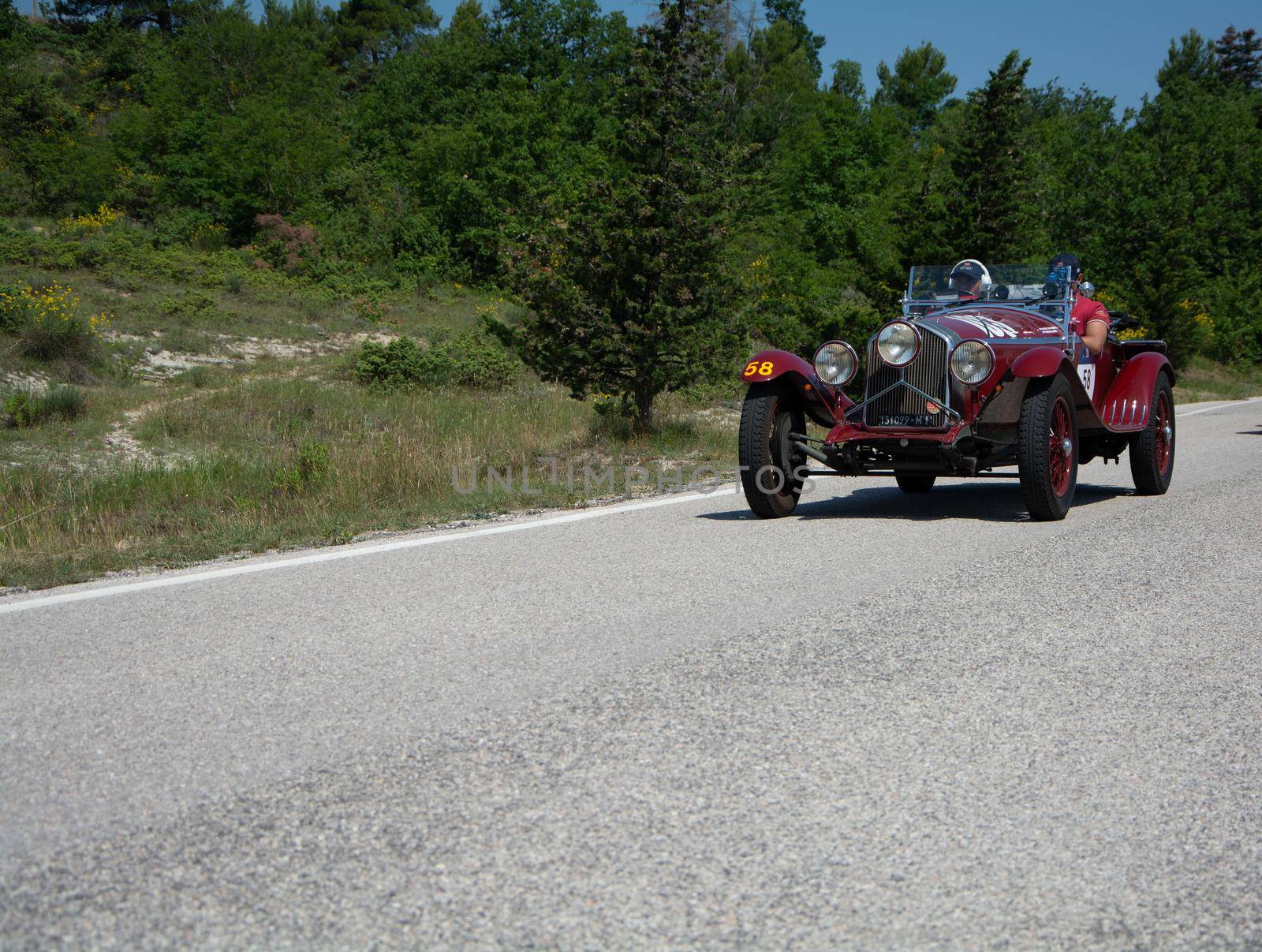 URBINO - ITALY - JUN 16 - 2022 : ALFA ROMEO 6C 1500 SUPER SPORT 1929 on an old racing car in rally Mille Miglia 2022 the famous italian historical race (1927-1957