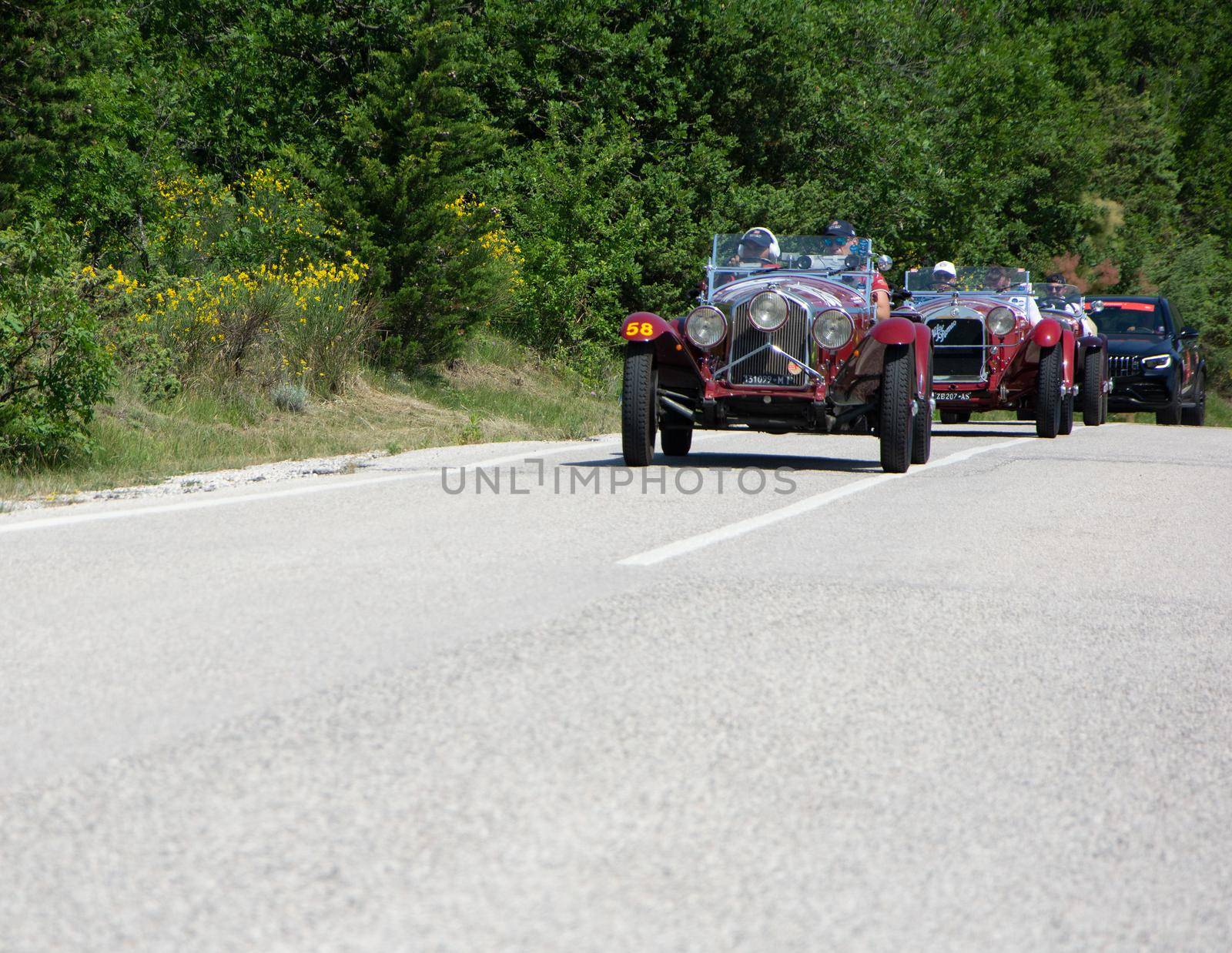 URBINO - ITALY - JUN 16 - 2022 : ALFA ROMEO 6C 1500 SUPER SPORT 1929 on an old racing car in rally Mille Miglia 2022 the famous italian historical race (1927-1957