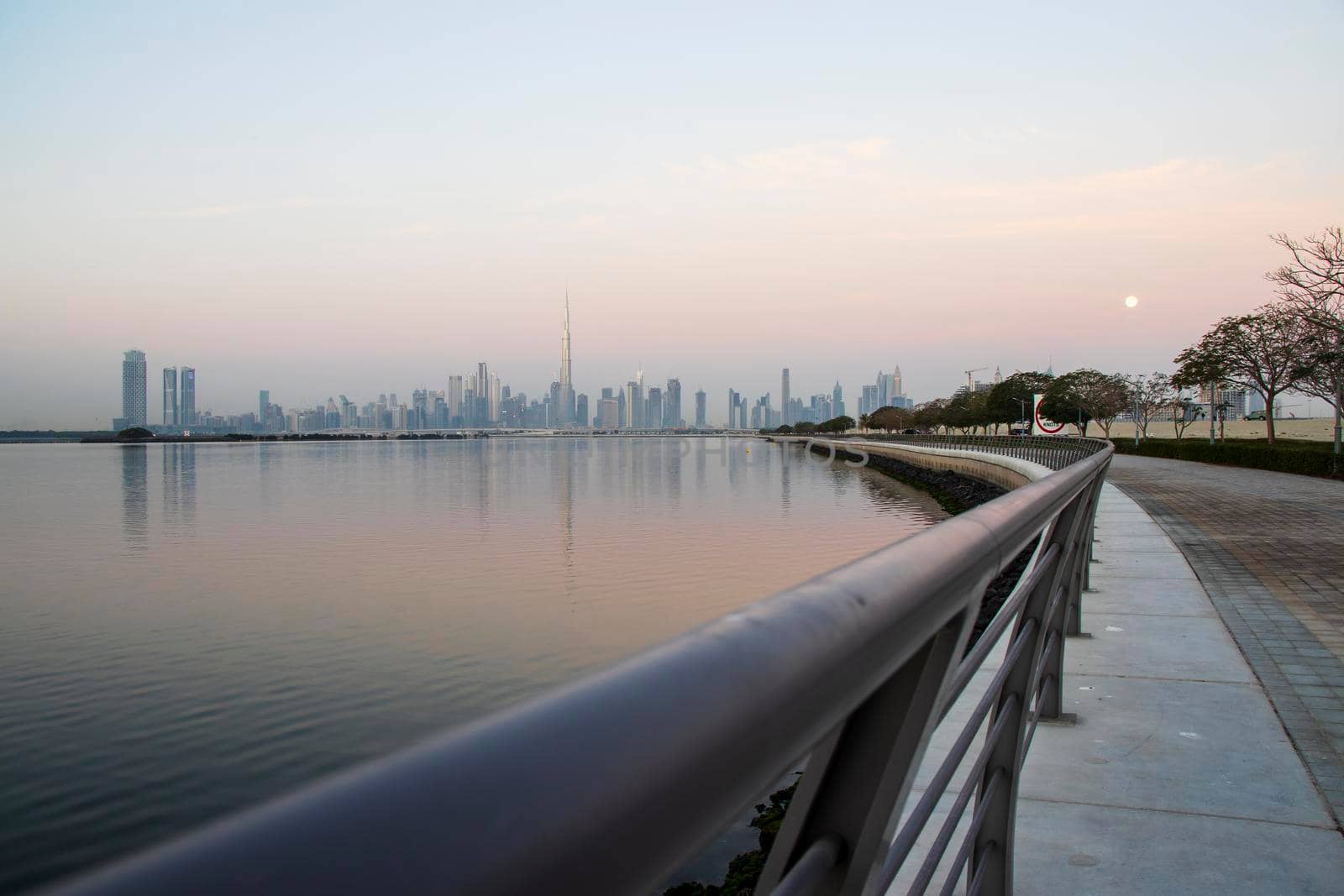 Dubai, UAE - 01.29.2021 Sunrise over Dubai city skyline. Outdoors by pazemin