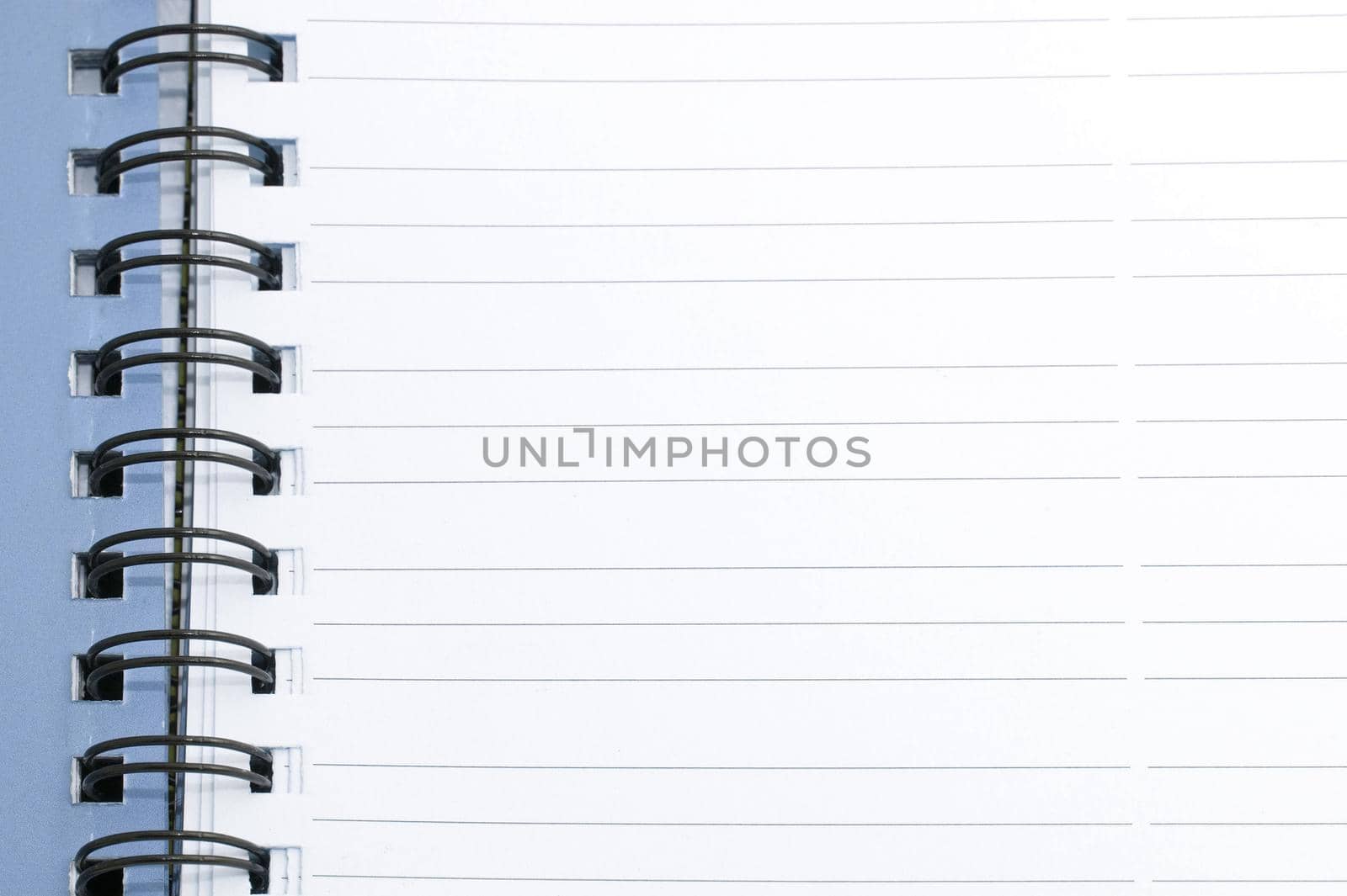 Spiral bound blank lined notebook page with room for your text or message