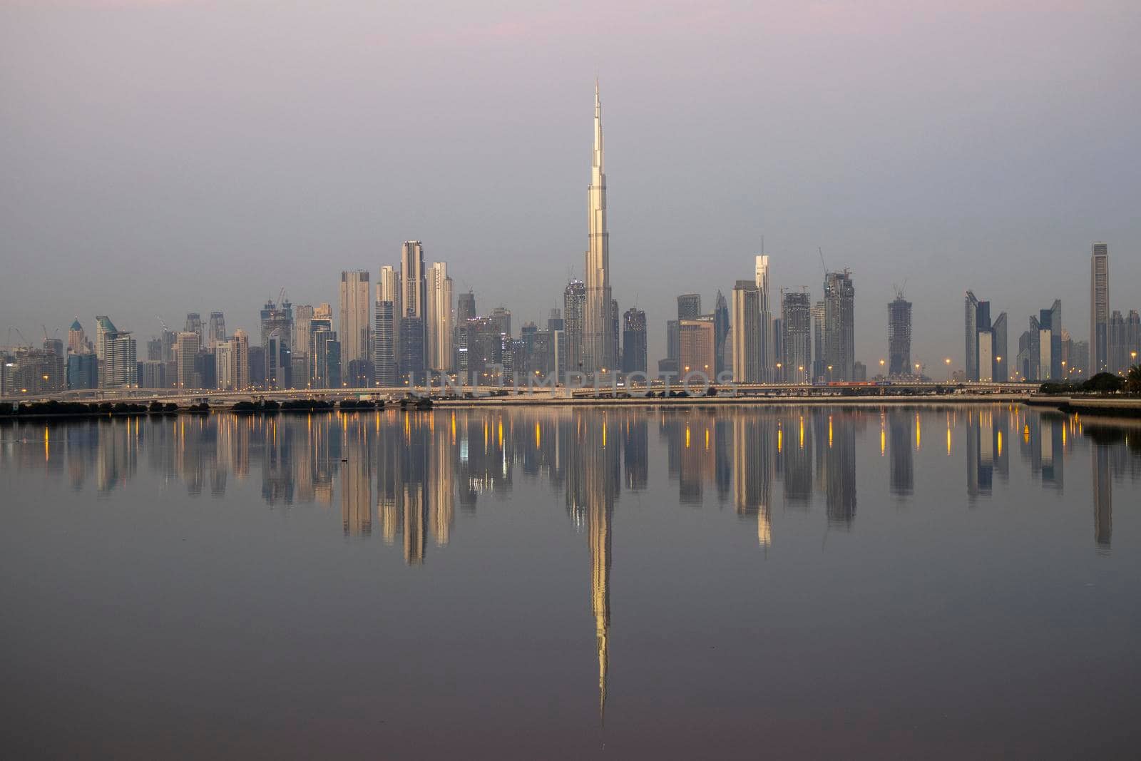 Dubai, UAE - 01.29.2021 Sunrise over Dubai city skyline. Outdoors by pazemin