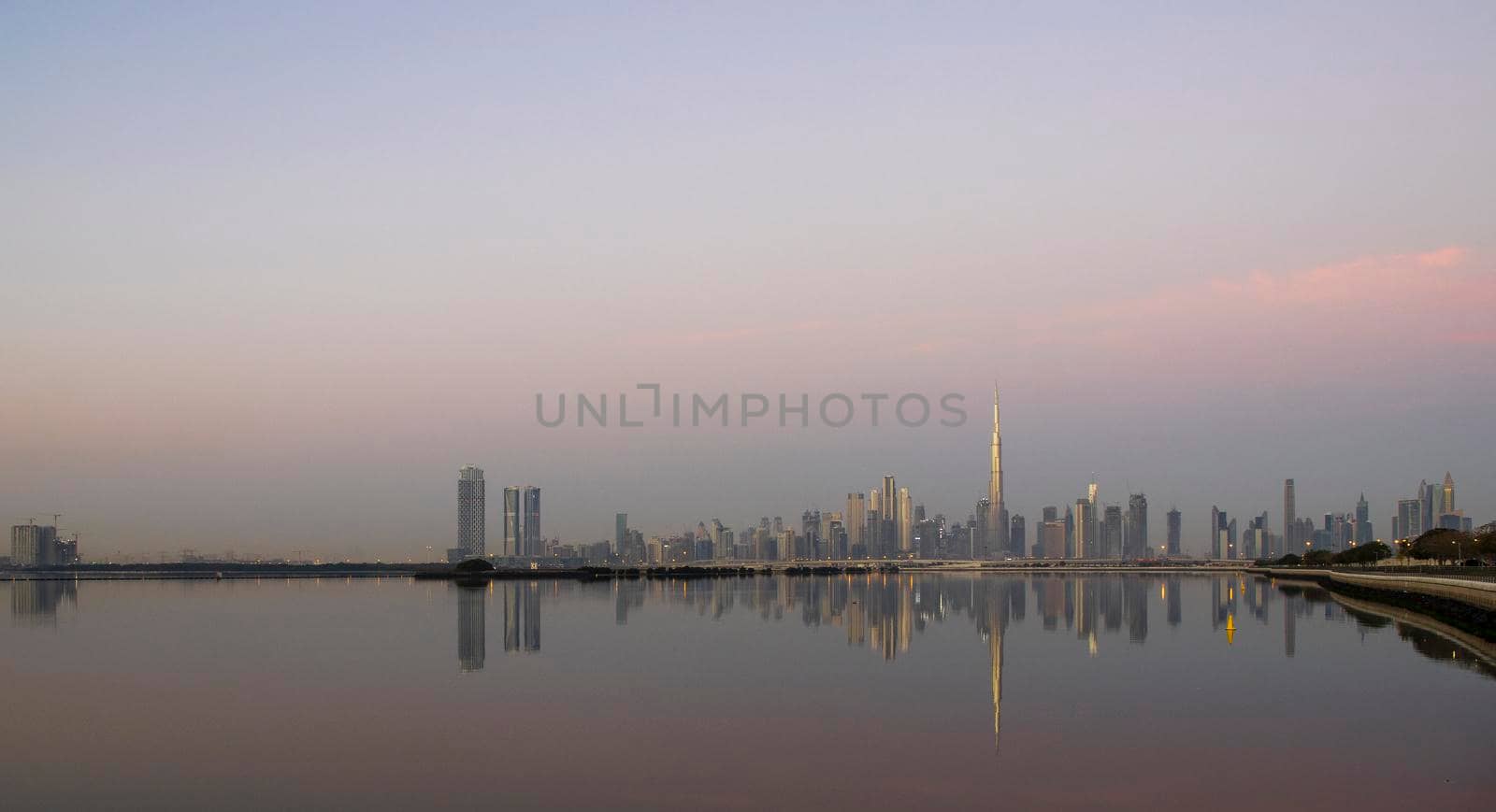 Dubai, UAE - 01.29.2021 Sunrise over Dubai city skyline. Outdoors by pazemin