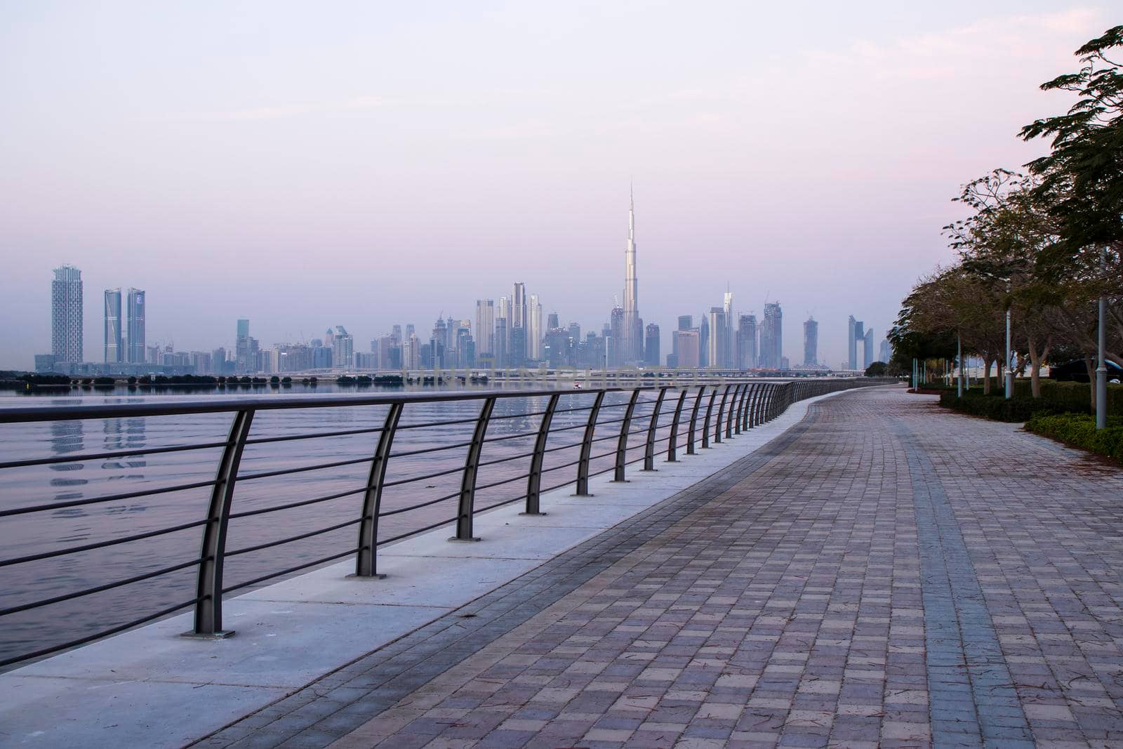 Dubai, UAE - 01.29.2021 Sunrise over Dubai city skyline. Outdoors by pazemin