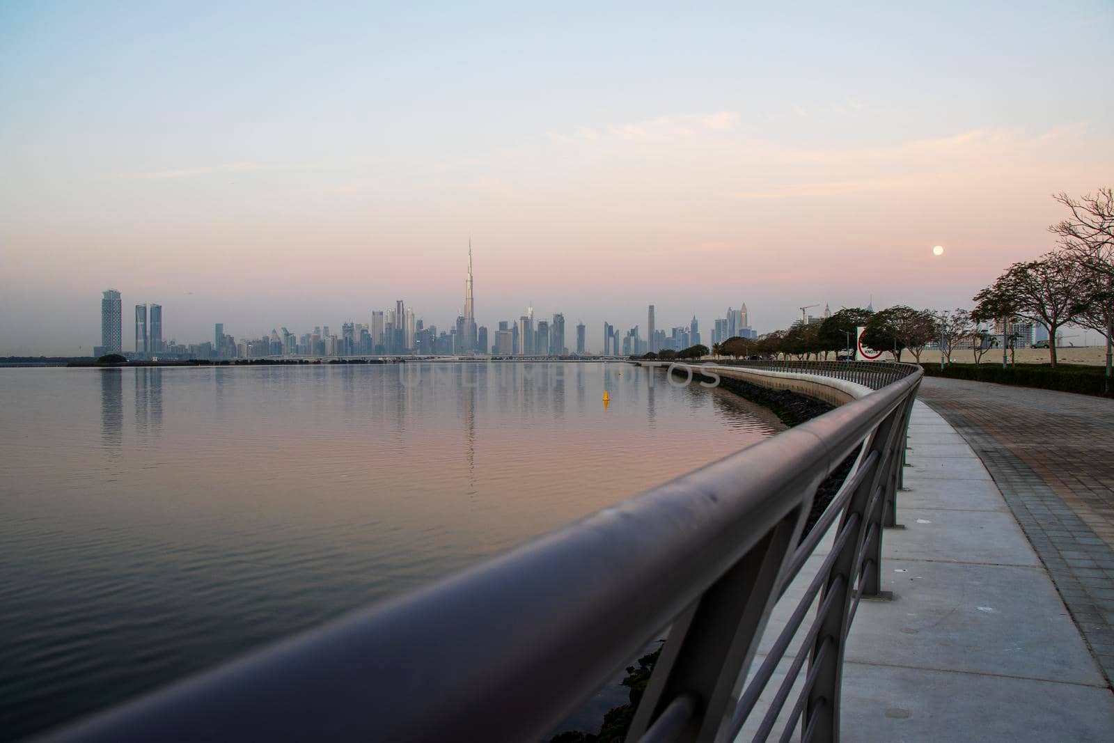 Dubai, UAE - 01.29.2021 Sunrise over Dubai city skyline. Outdoors by pazemin