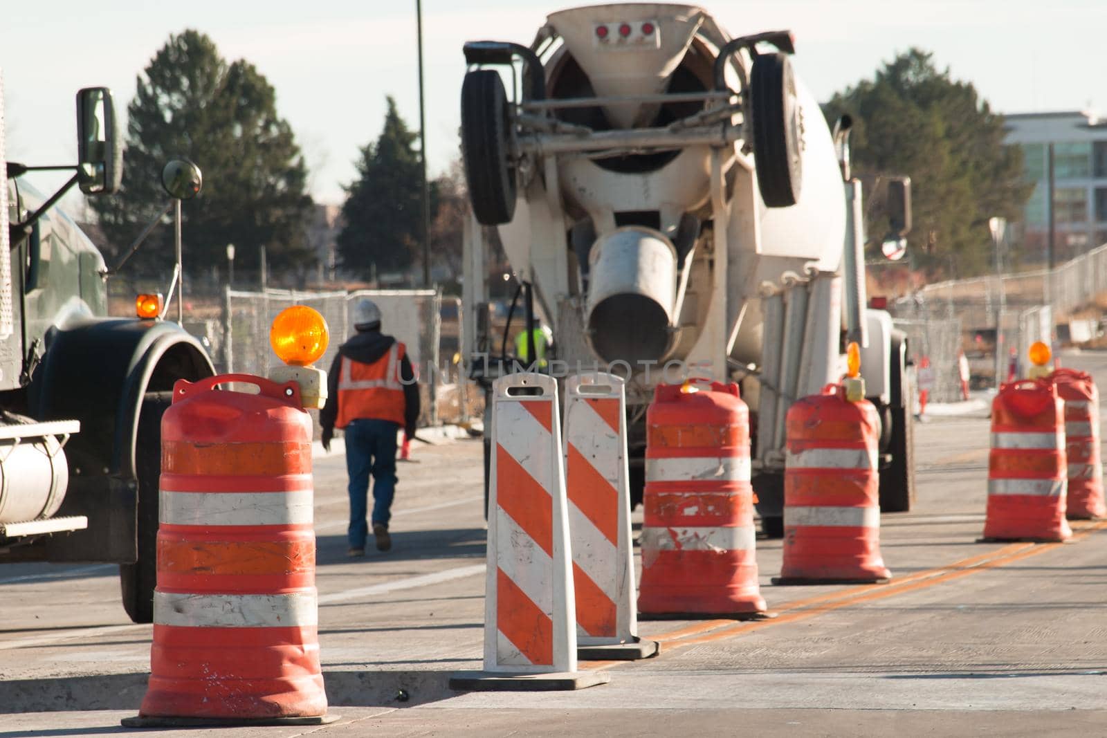 Cement mixer truck at construction site.