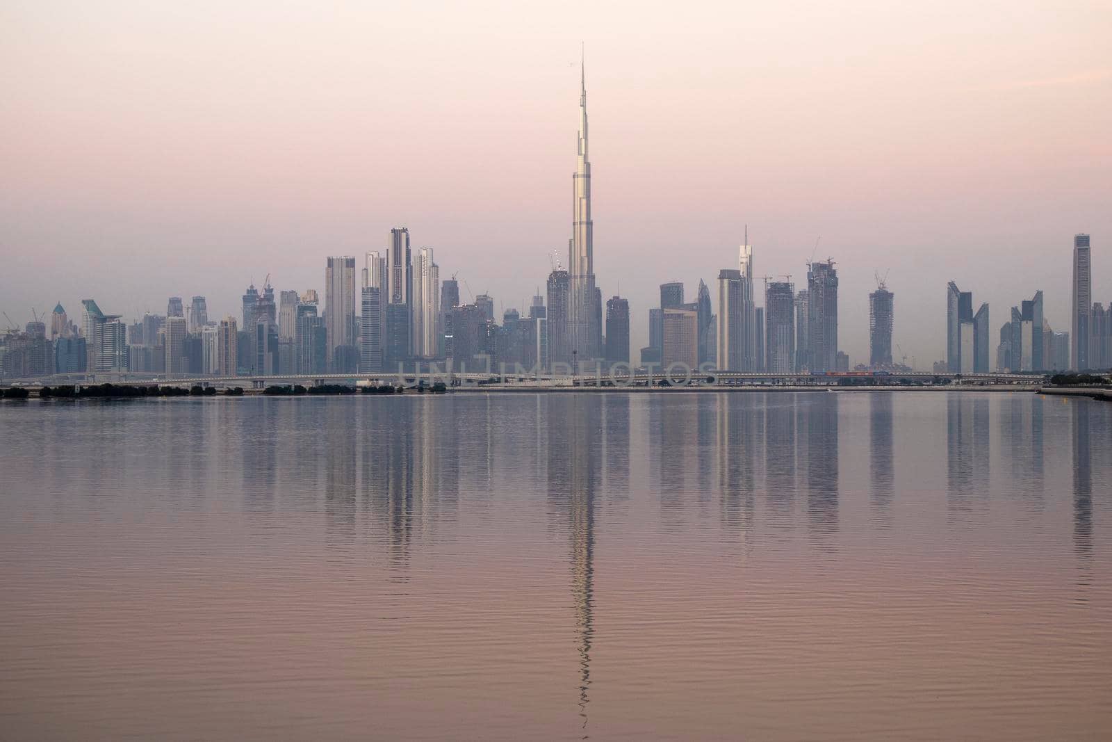 Dubai, UAE - 01.29.2021 Sunrise over Dubai city skyline.