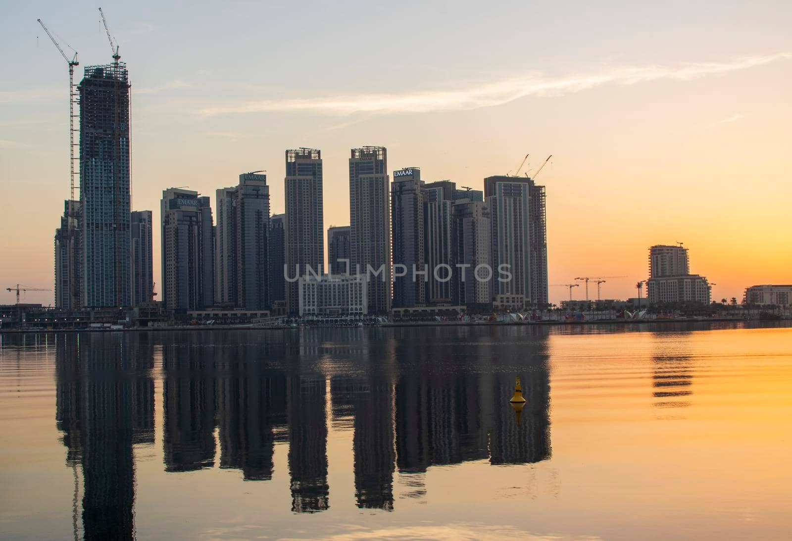 Dubai, UAE - 01.29.202 Sunrise over Dubai city skyline. Creek Harbor by EMAAR. Outdoors by pazemin