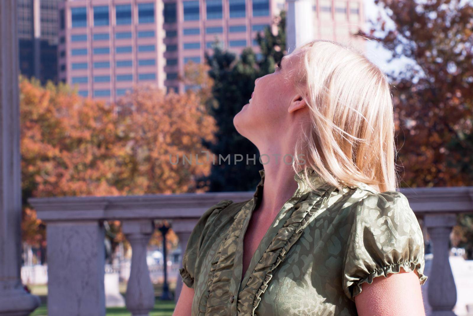 Blond woman looking around.