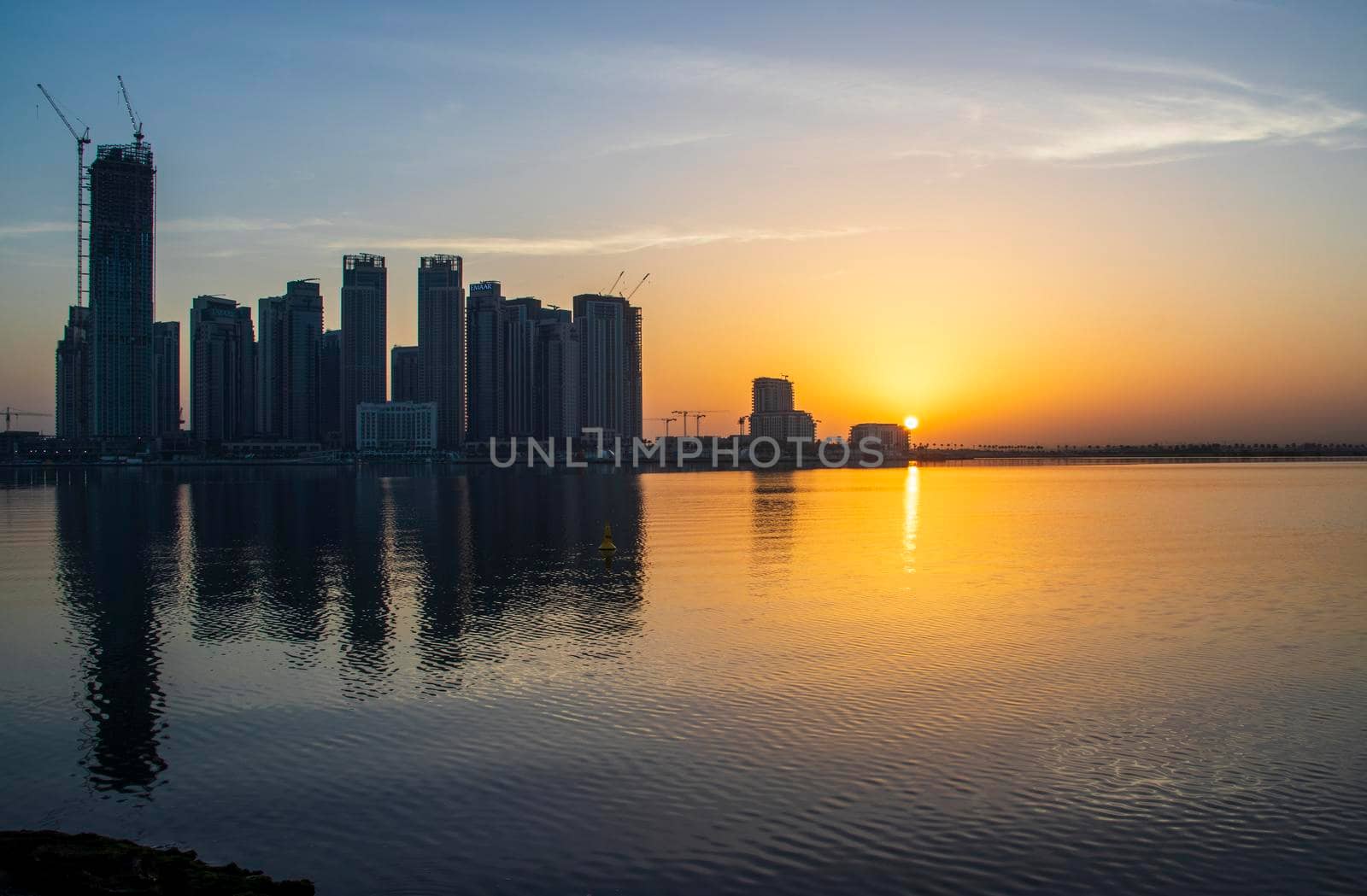 Dubai, UAE - 01.29.2021 Sunrise over Dubai city skyline. Creek Harbor by EMAAR