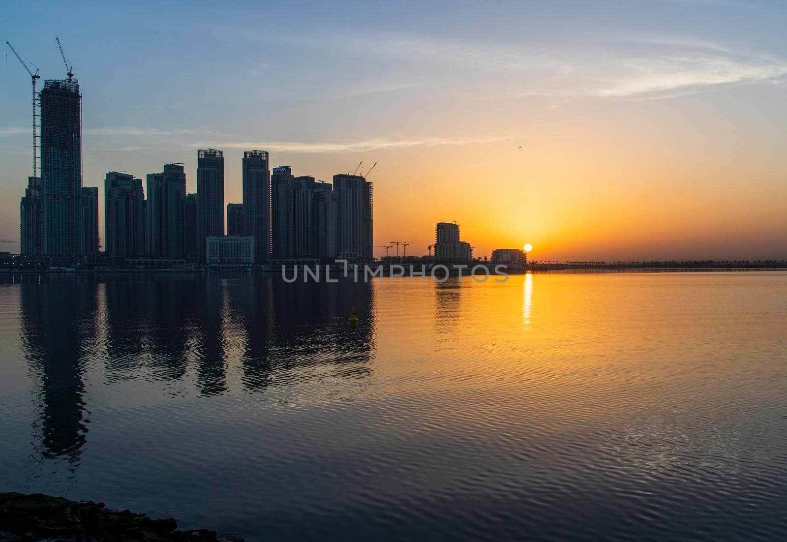 Dubai, UAE - 01.29.2021 Sunrise over Dubai city skyline. Creek Harbor by EMAAR