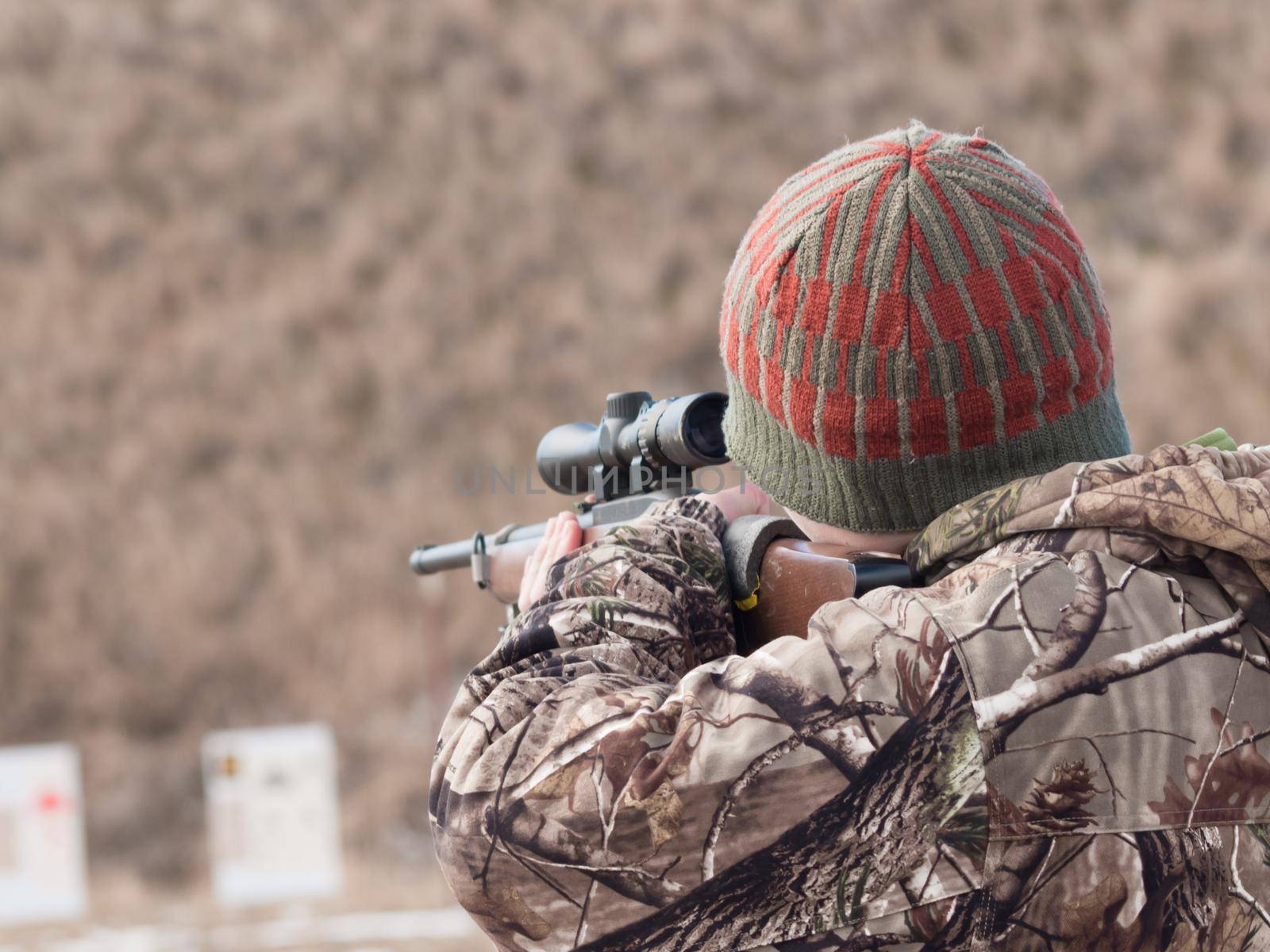 young boy practicing rifle marksmanship at the Appleseed Project.