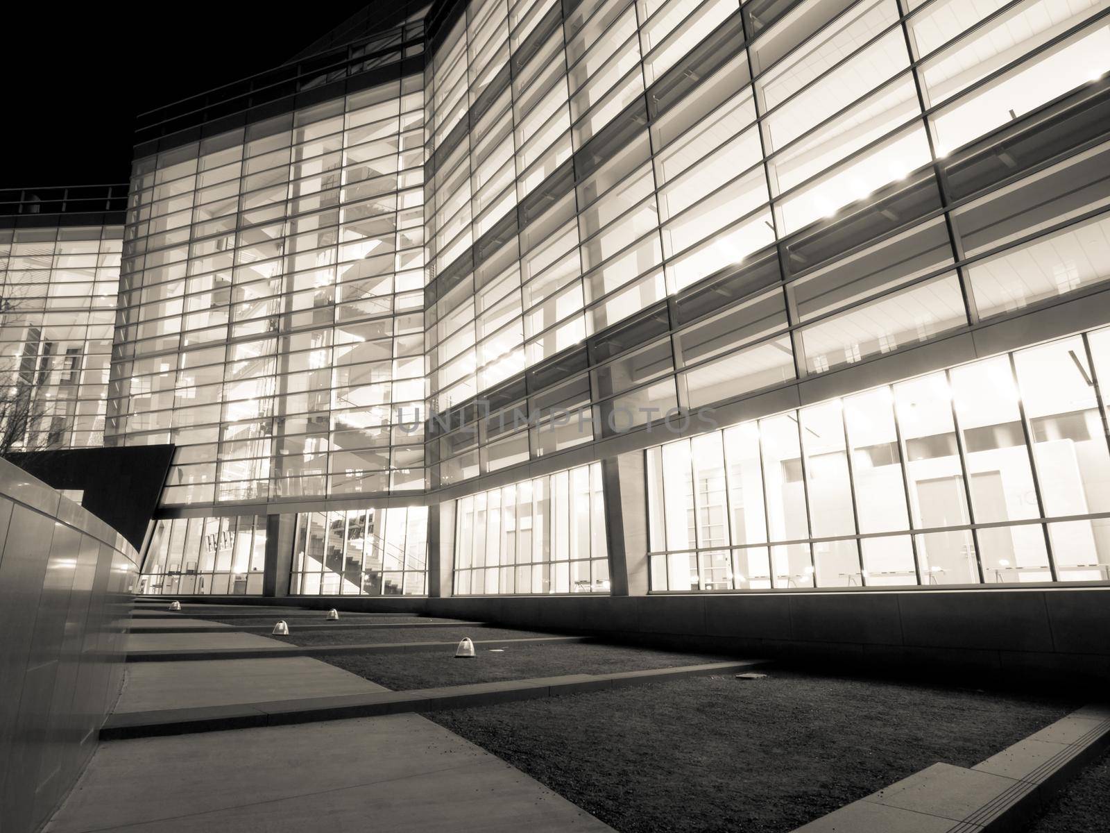 Office building at night by arinahabich