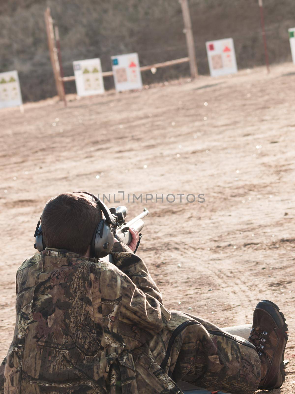 Young boy practicing rifle marksmanship at the Appleseed Project.