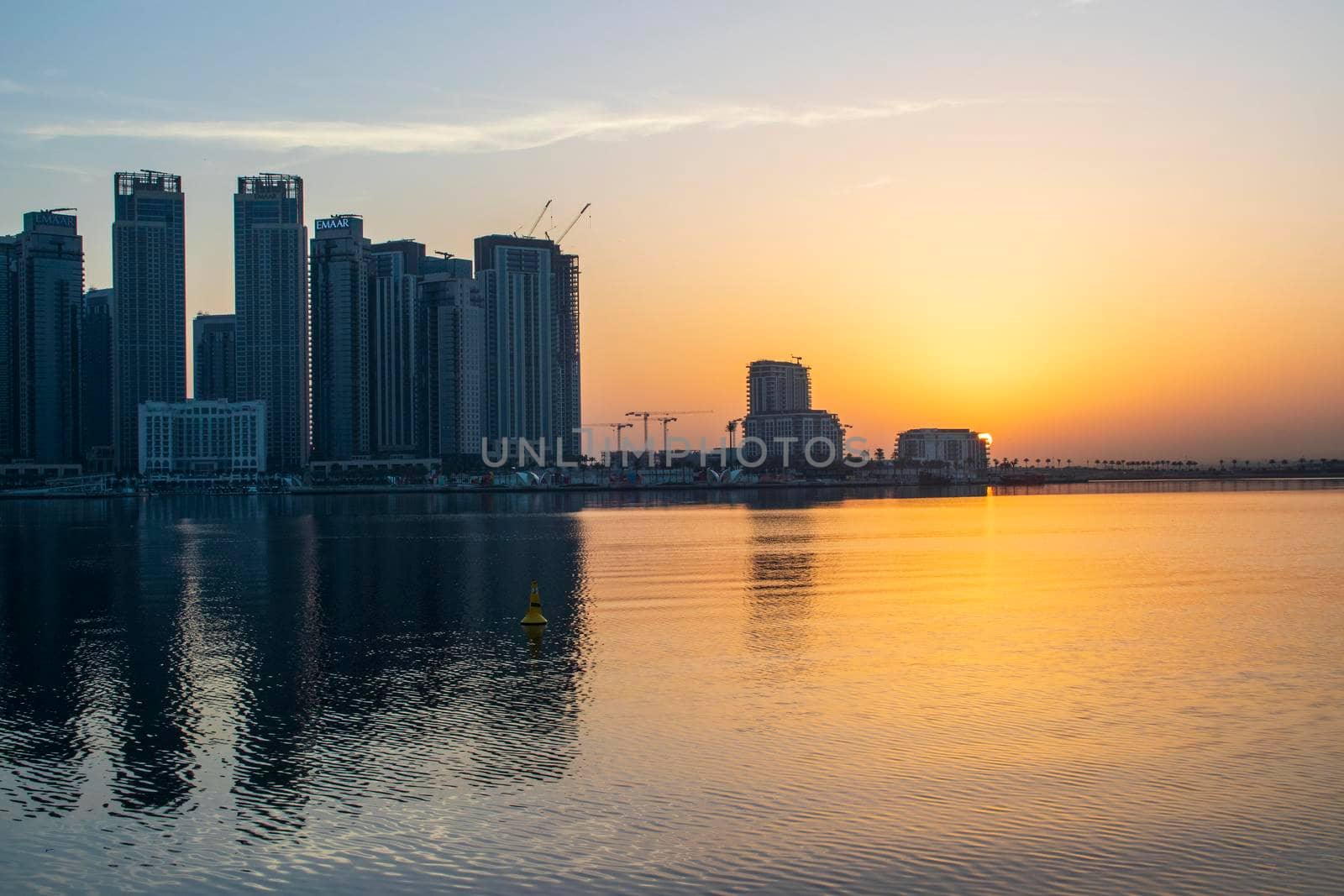 Dubai, UAE - 01.29.2021 Sunrise over Dubai city skyline. Creek Harbor by EMAAR