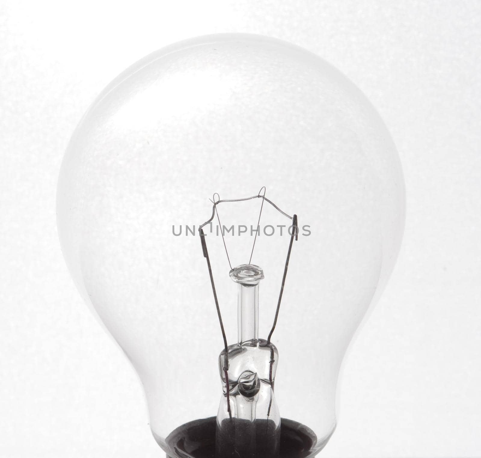 Close up on a glass incandescent light bulb by sanisra