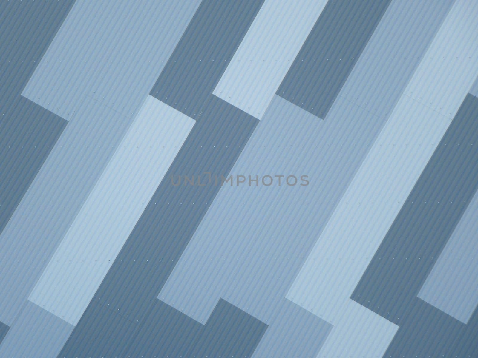 Decorative blue exterior building cladding in a striking diagonal geometric design in a full frame architectural background