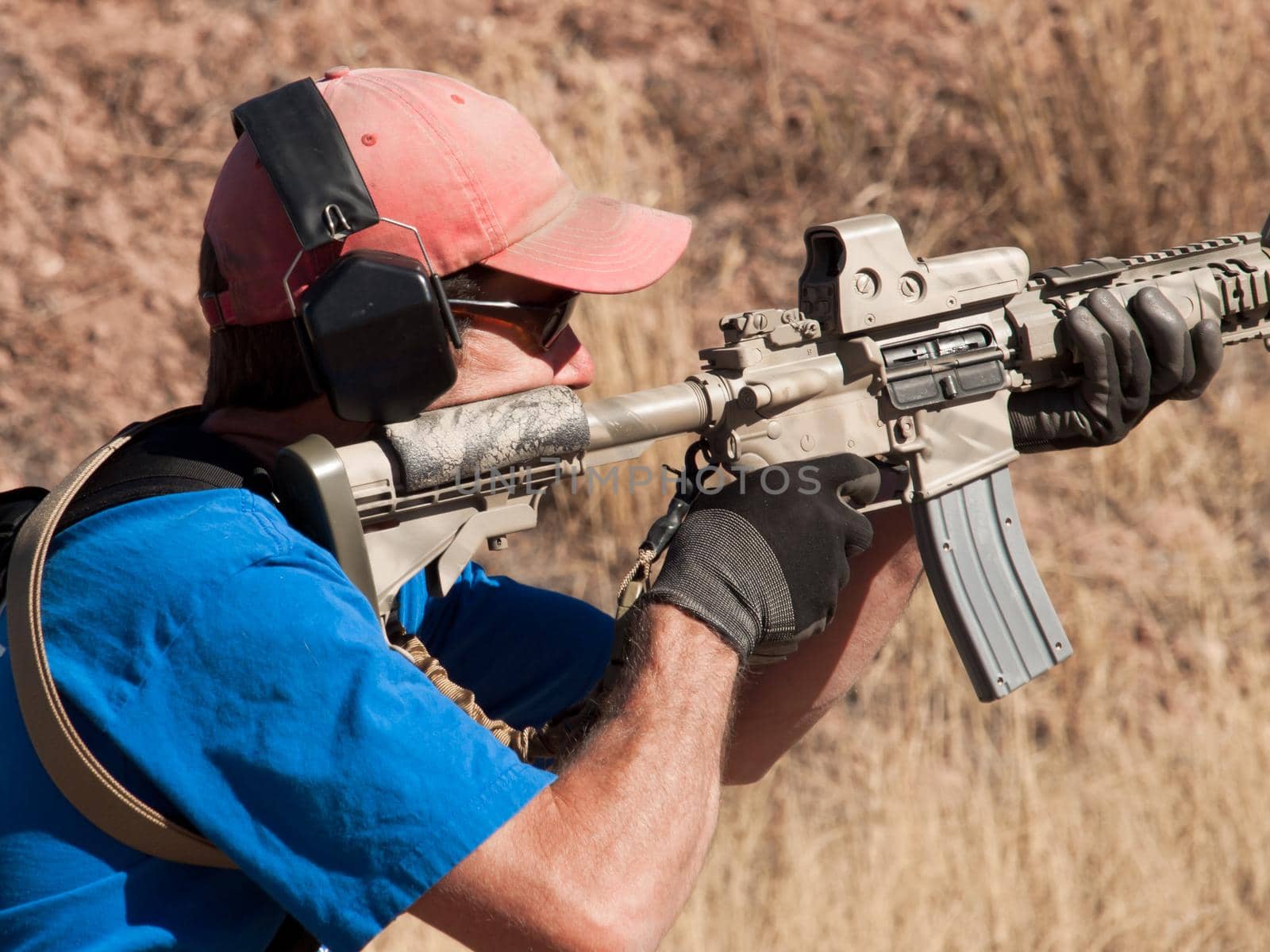 Man with AR-15 practicing target shooting.