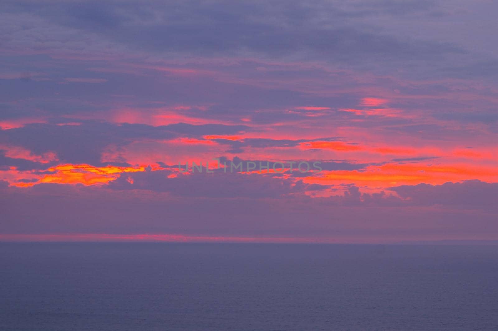 dusk sky glowing red with a beautiful vivid sunset
