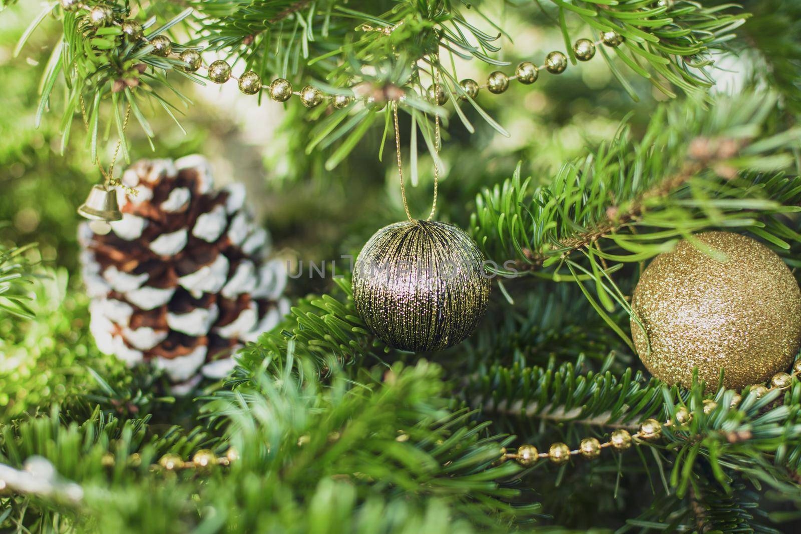 Gold decoration toys and cone on the Christmas tree