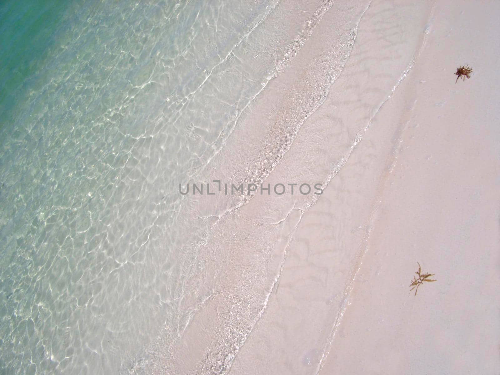 sands and blue waters of a tropical snady beach