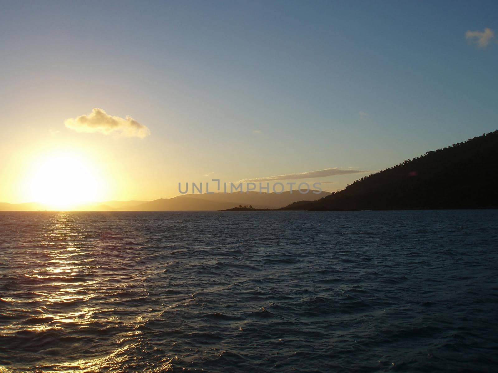 sunset sailing over the water