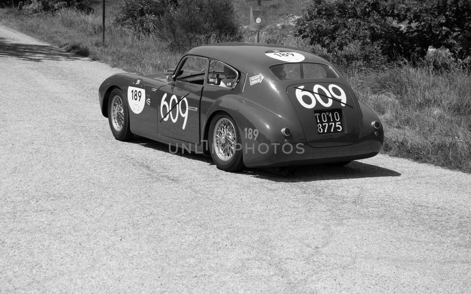 URBINO - ITALY - JUN 16 - 2022 : ERMINI 1100 BERLINETTA MOTTO 1950 on an old racing car in rally Mille Miglia 2022 the famous italian historical race (1927-1957