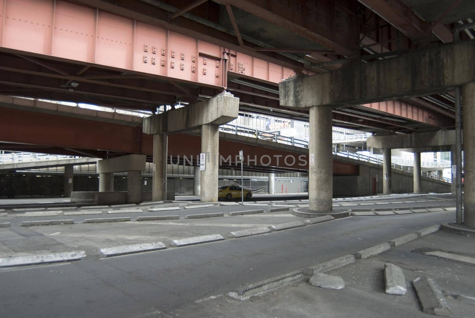 Urban wasteland under flyover motorways with empty space and streets devoid of both cars and people