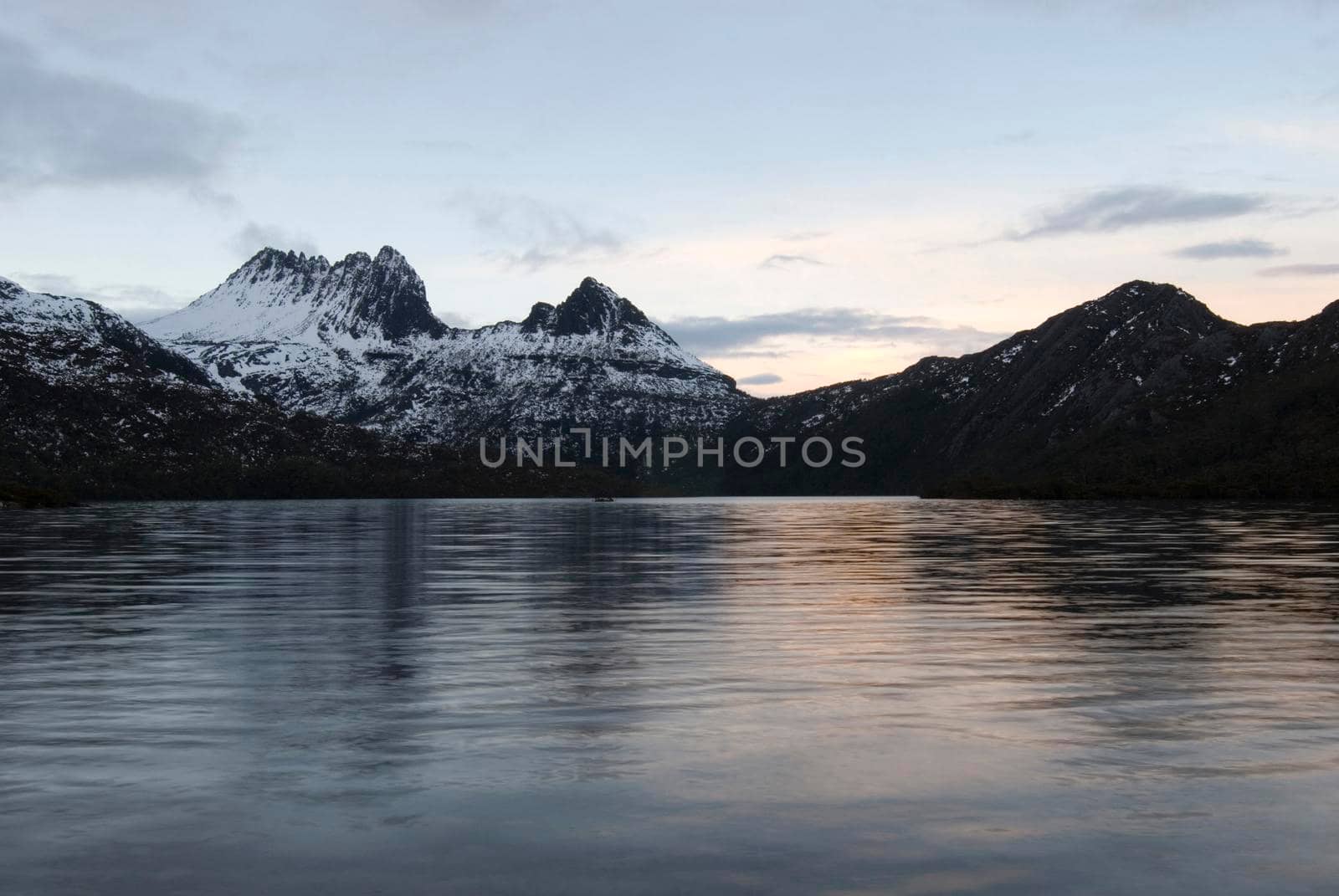 cradle and surrounding mountains framed with the waters of dove lake