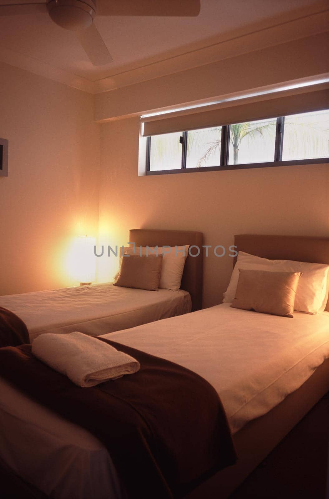 Modern twin bedroom in a hotel or bed and breakfast with minimalist decor in neutral tones