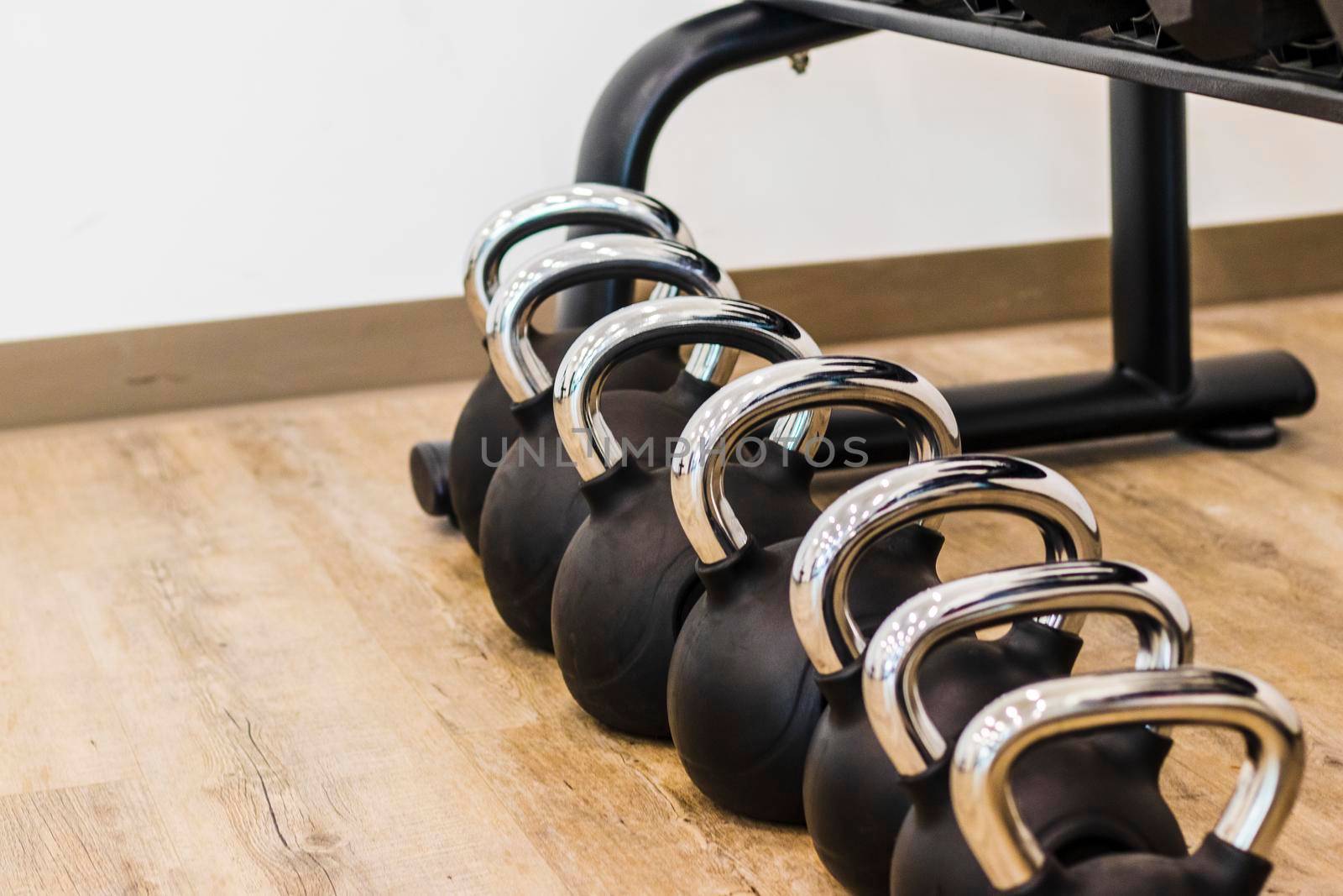 Close up shot of various gym equipment and weights.