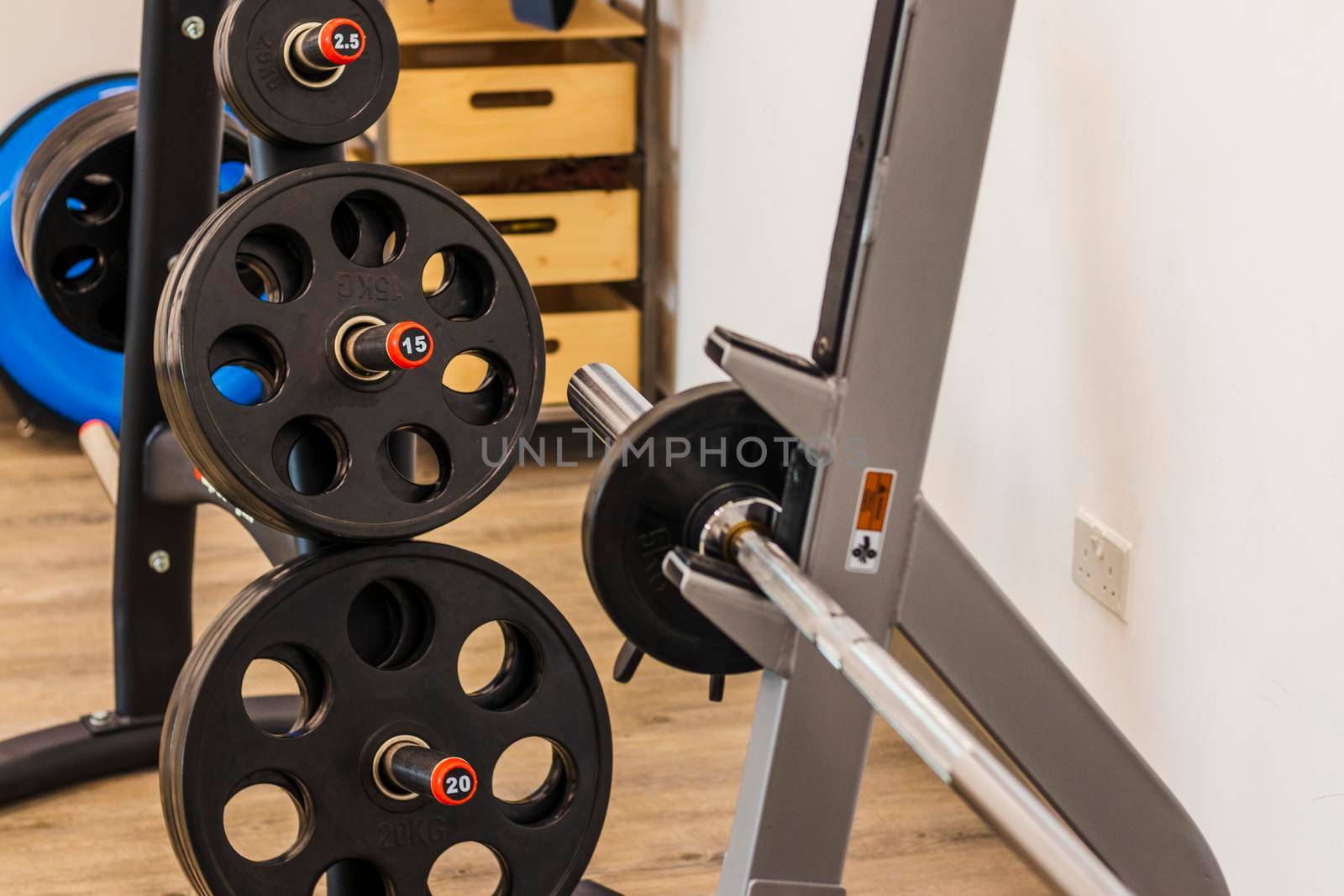 Close up shot of various gym equipment and weights.