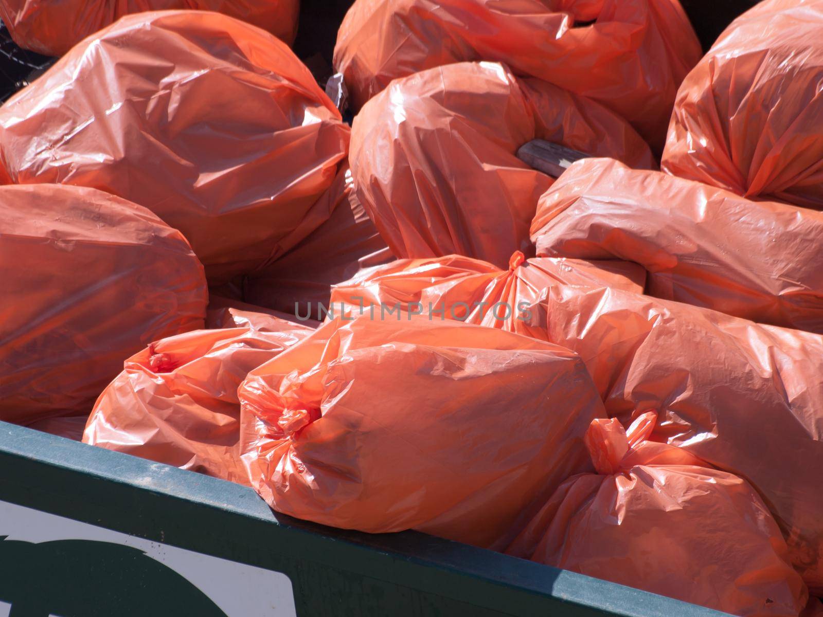 Pile of orange garbage bags.