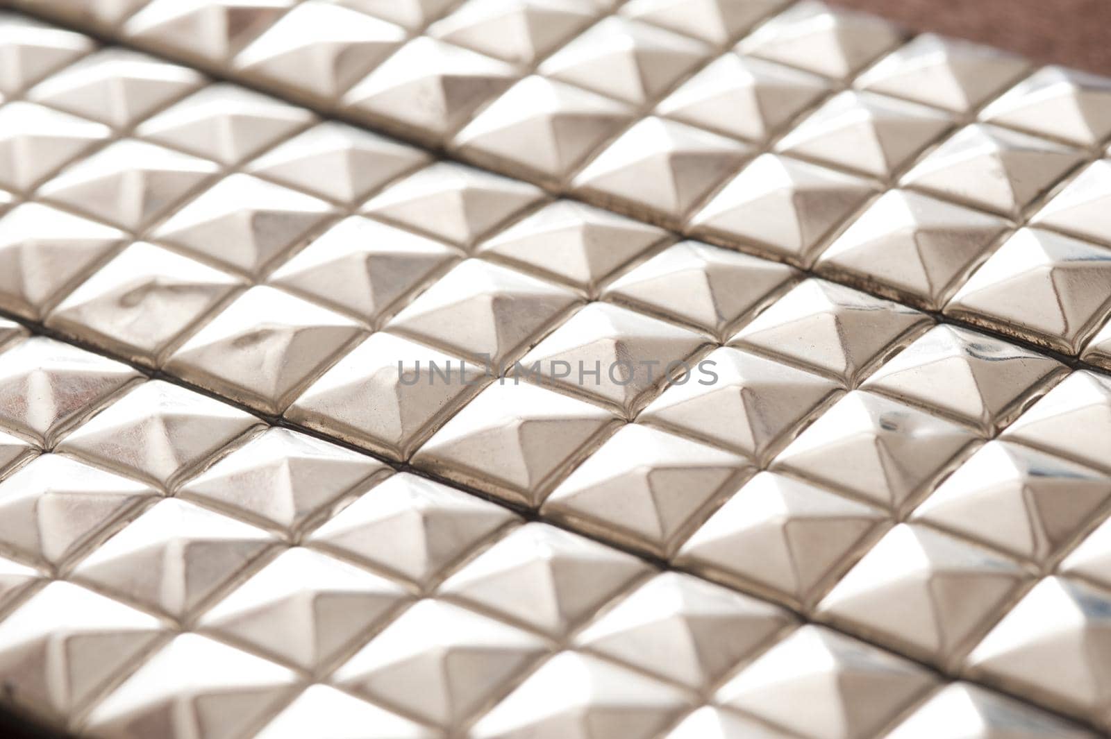 rows of square metal punk jacket studs