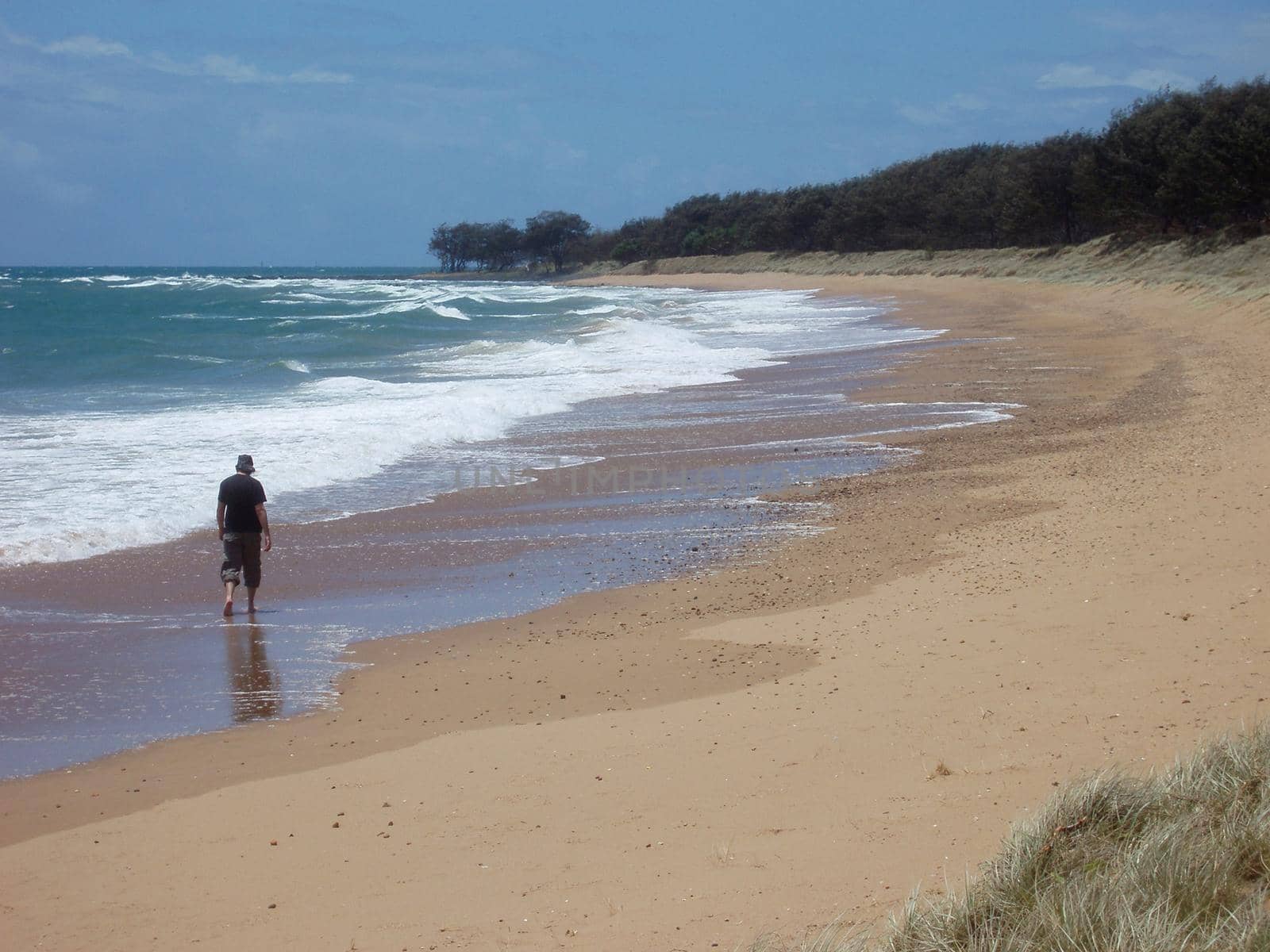 a relaxing walk in the surf is even better if you have the beach all to yourself
