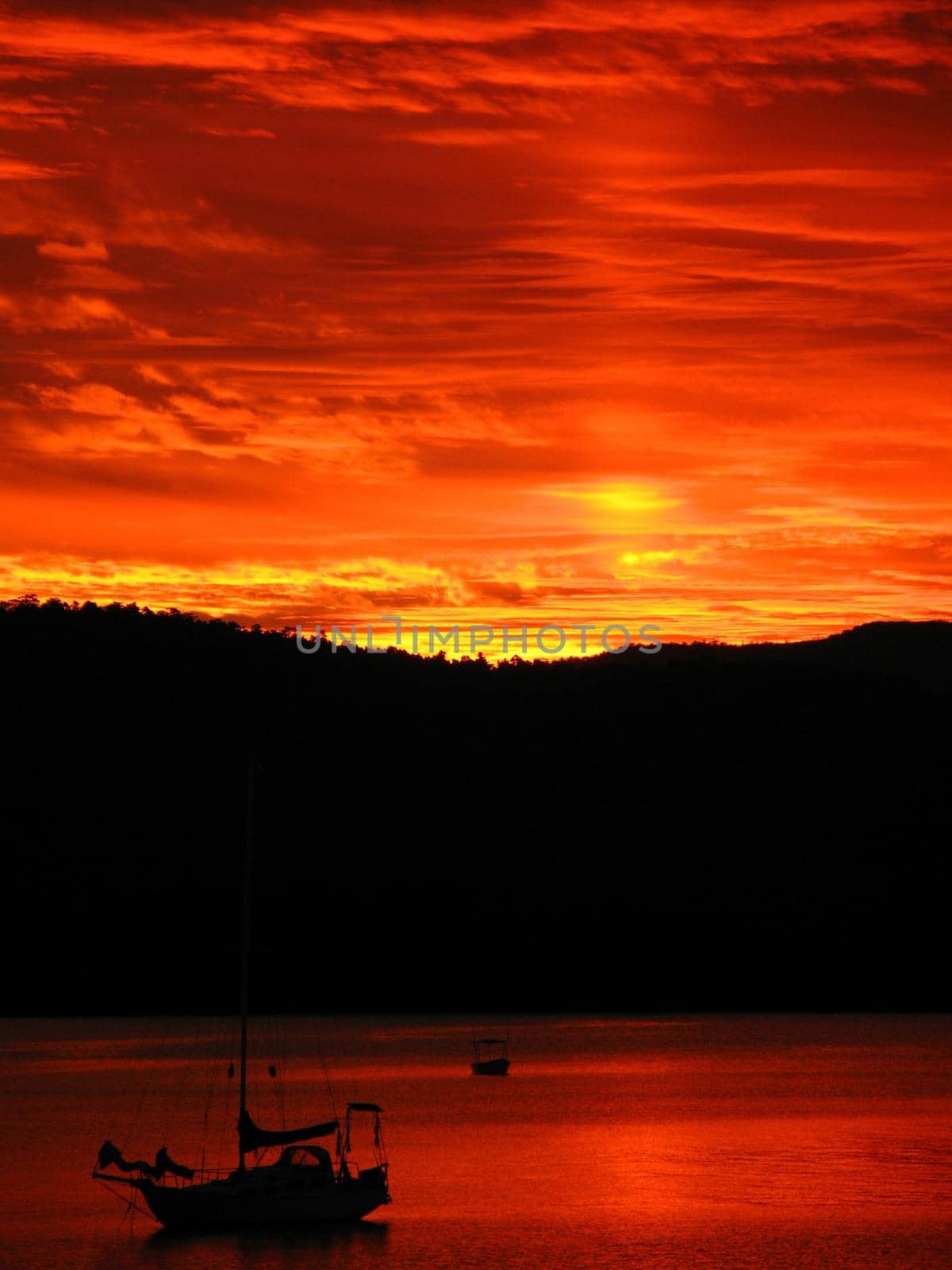 a bright flame red sky at sunset