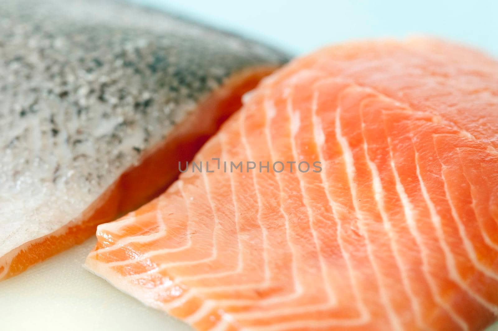 Close up of raw uncooked fresh salmon steaks showing the texture of the flesh of this seafood delicacy