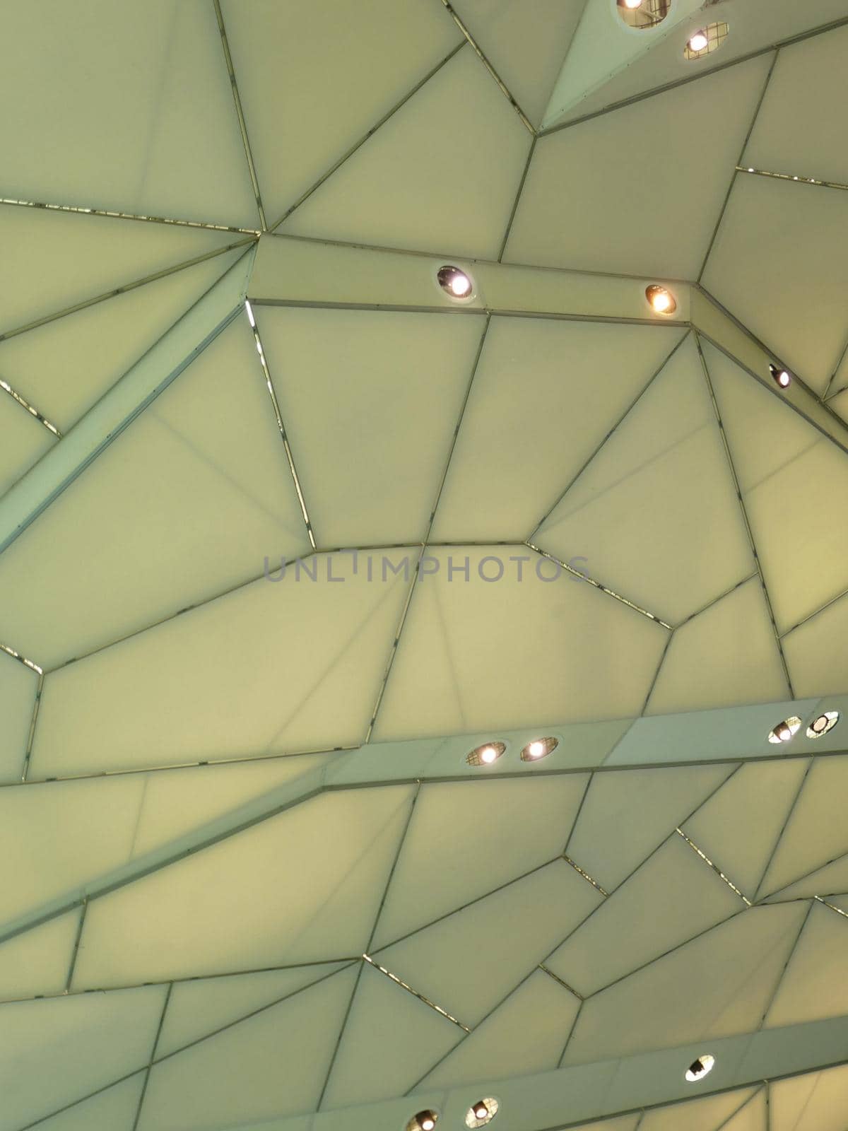 Looking Up at Architectural Detail of Ceiling with Abstract Geometric Pattern and Pot Lighting, Ideal for Backgrounds