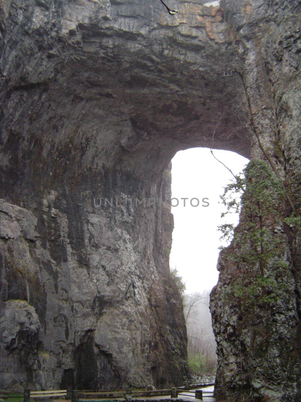 a rock arch in a sheer cliff face