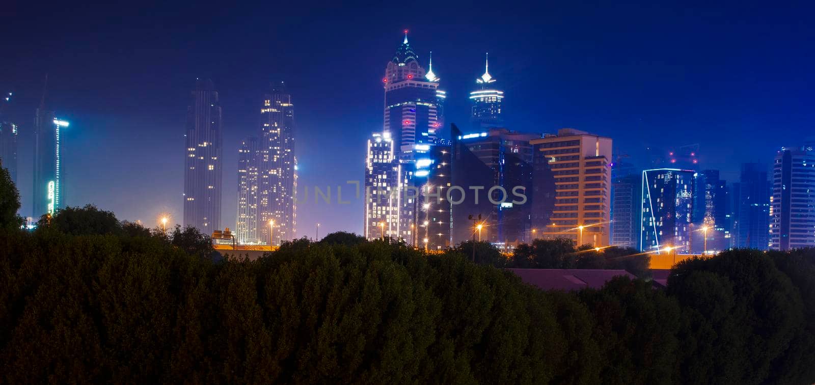 Dubai, UAE - 06.04.2021 Business bay district at night. Urban by pazemin