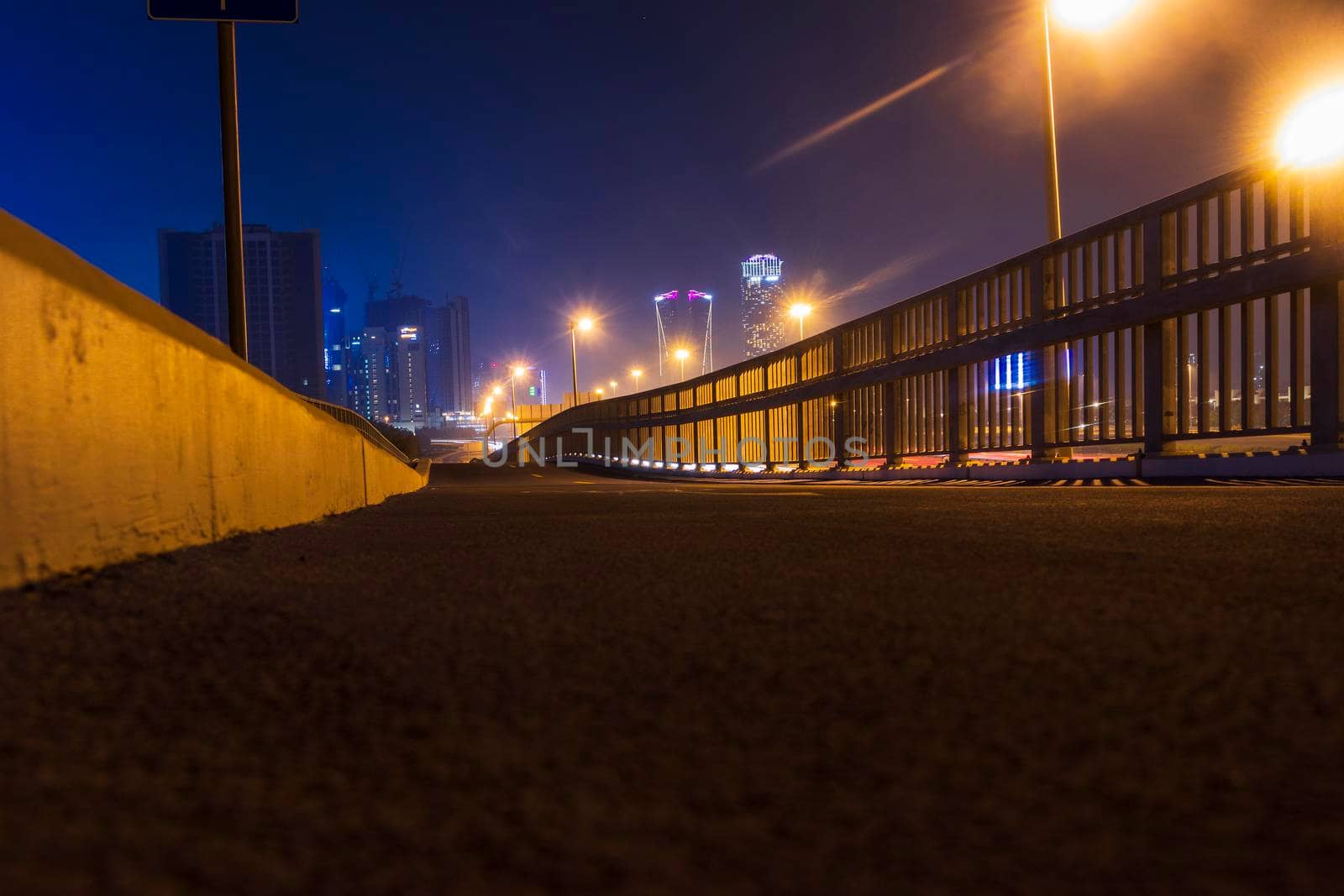 Dubai, UAE - 06.04.2021 Cycling track along Al Khail road at night