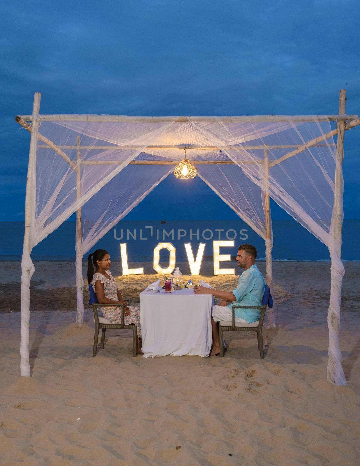 Romantic dinner on beach of Huahin Thailand, dinner by candle light in Hua Hin ,Valentine concept by fokkebok