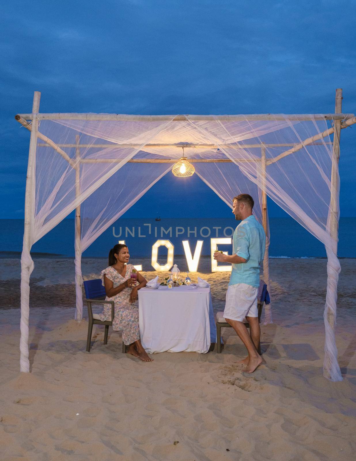 Romantic dinner on beach of Huahin Thailand, dinner by candle light in Hua Hin ,Valentine concept by fokkebok