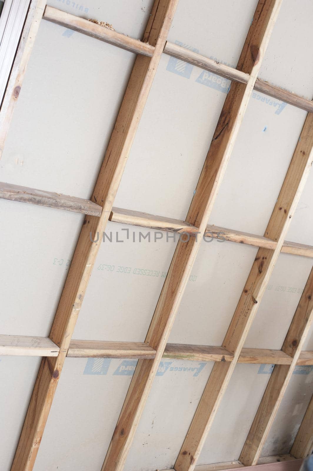 Wall studding with timber framework for attaching plasterboard during construction