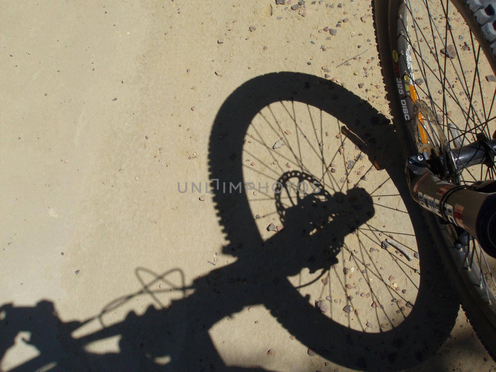 looking down at the front wheel of a downhill mountainbike