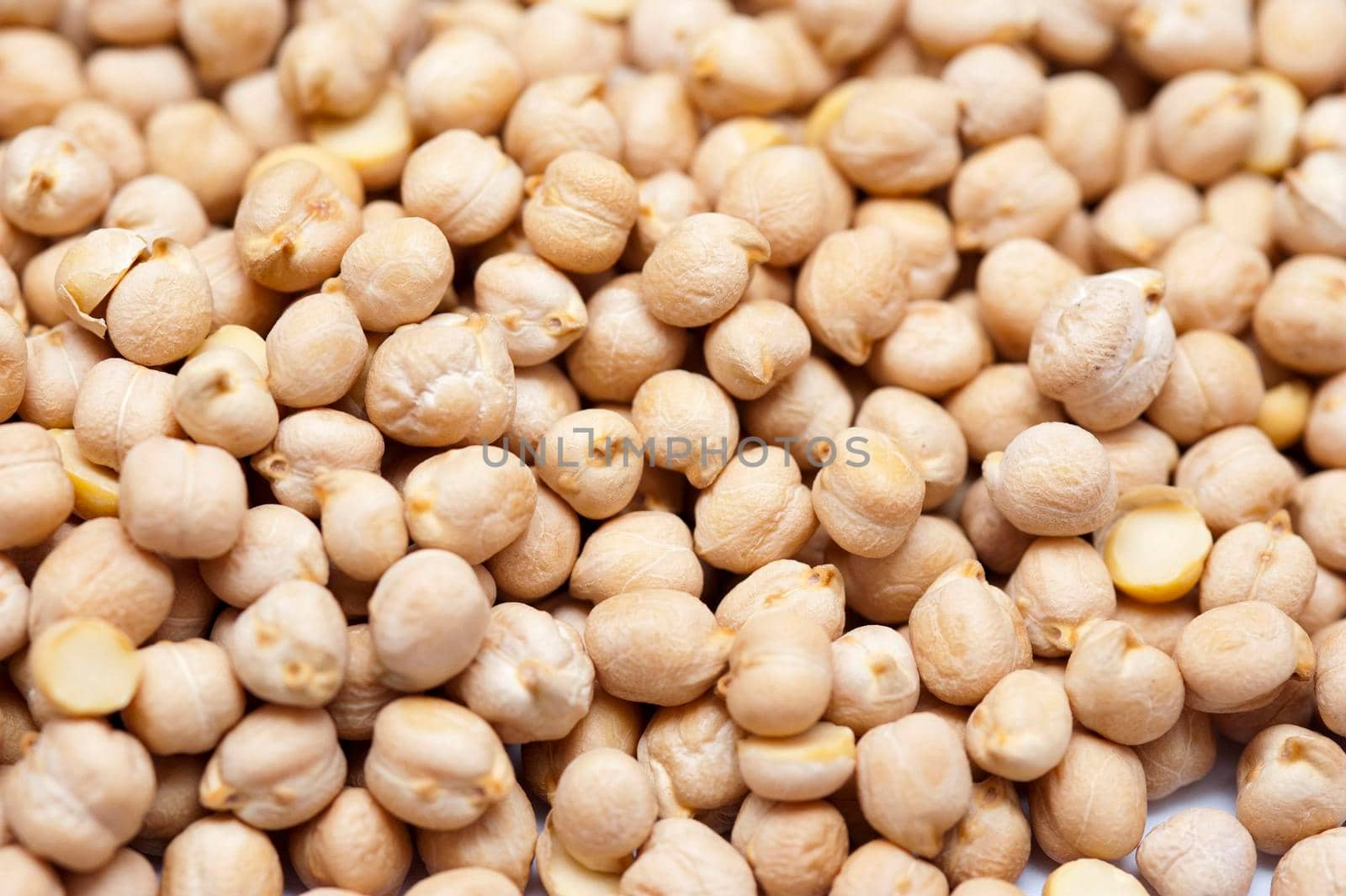 Background of chickpeas, or garbanzo beans, a seed of the Cicer arietinum plant which is high in protein and was one of the first vegetables to be cultivated