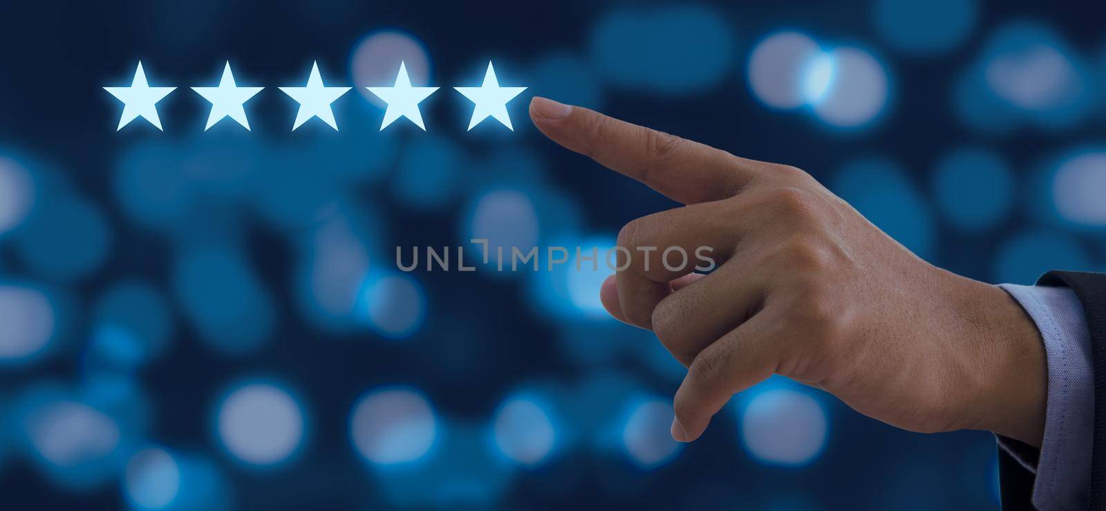 Hand of businessman touching five stars symbol to increase rating on background by aoo3771