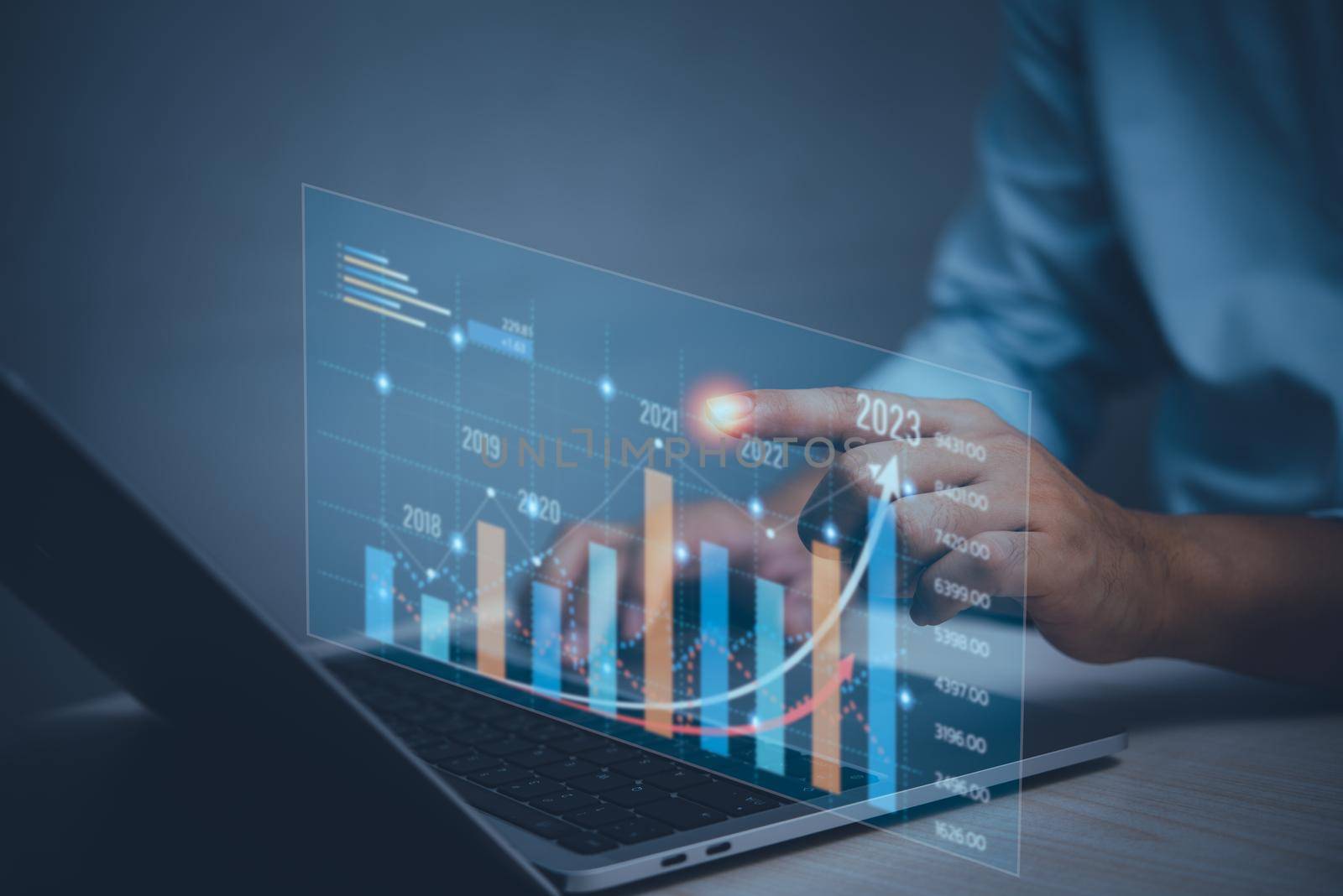 business finance technology and investment concept.Businessman increase arrow graph future growth year 2023 concept. by aoo3771